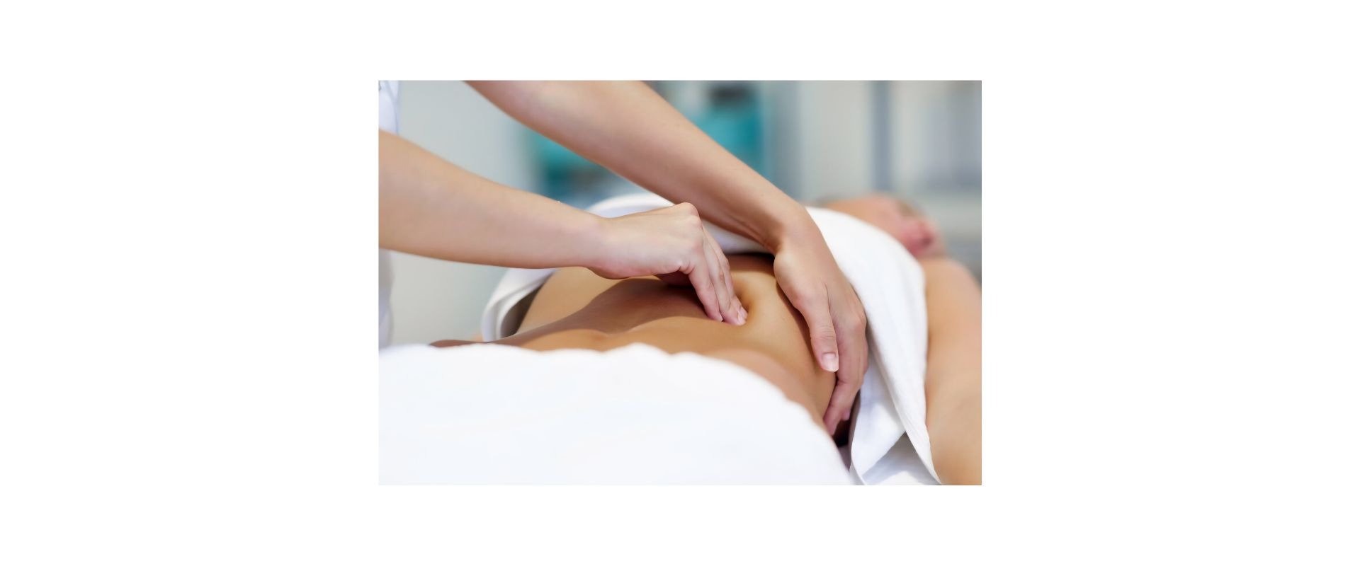 a pregnant woman in a tan top and black pants