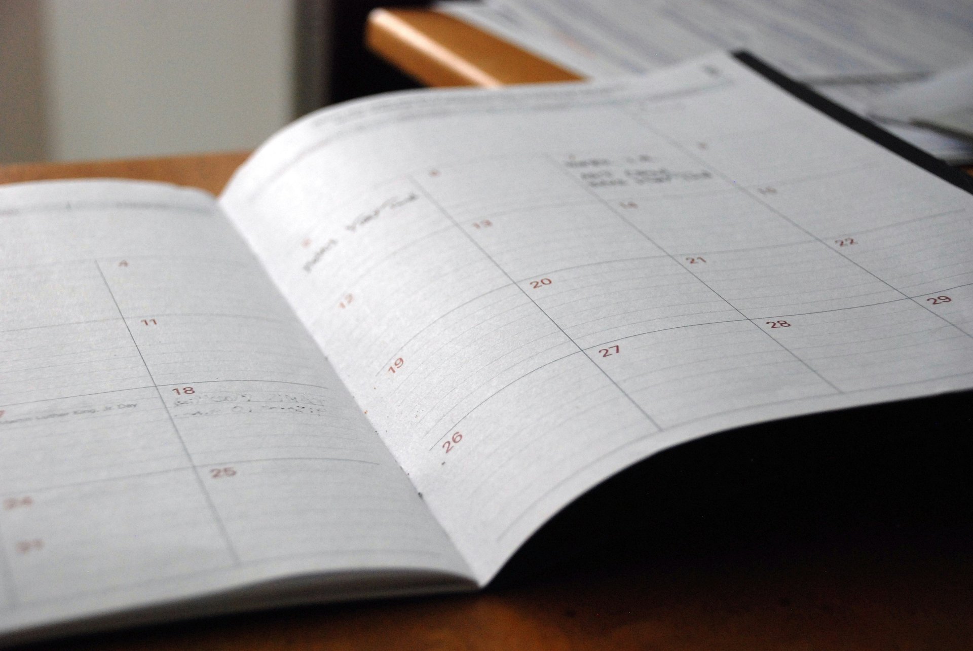 a notebook with a pen and a notebook