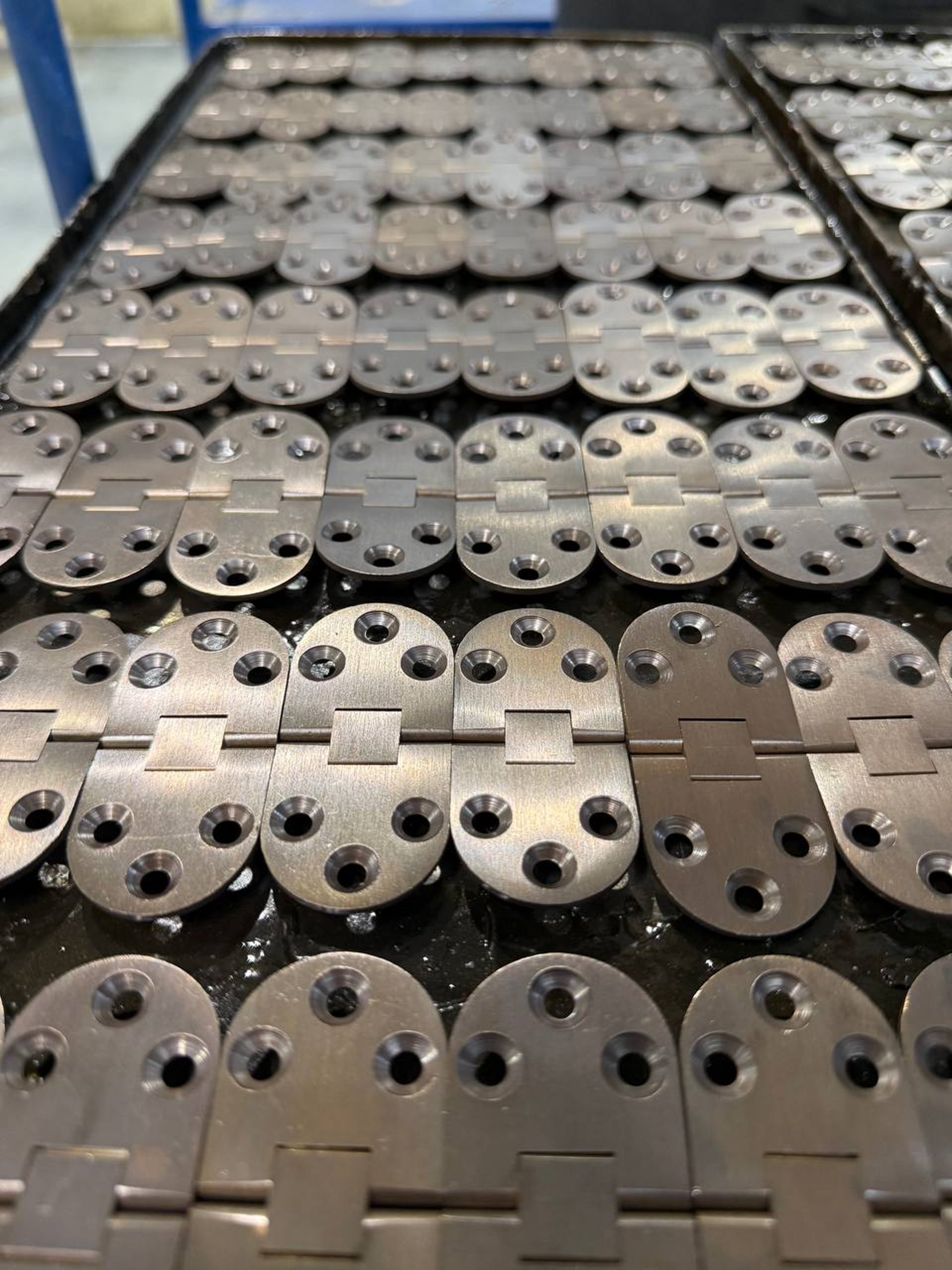 an abstract photo of a curved building with a blue sky in the background