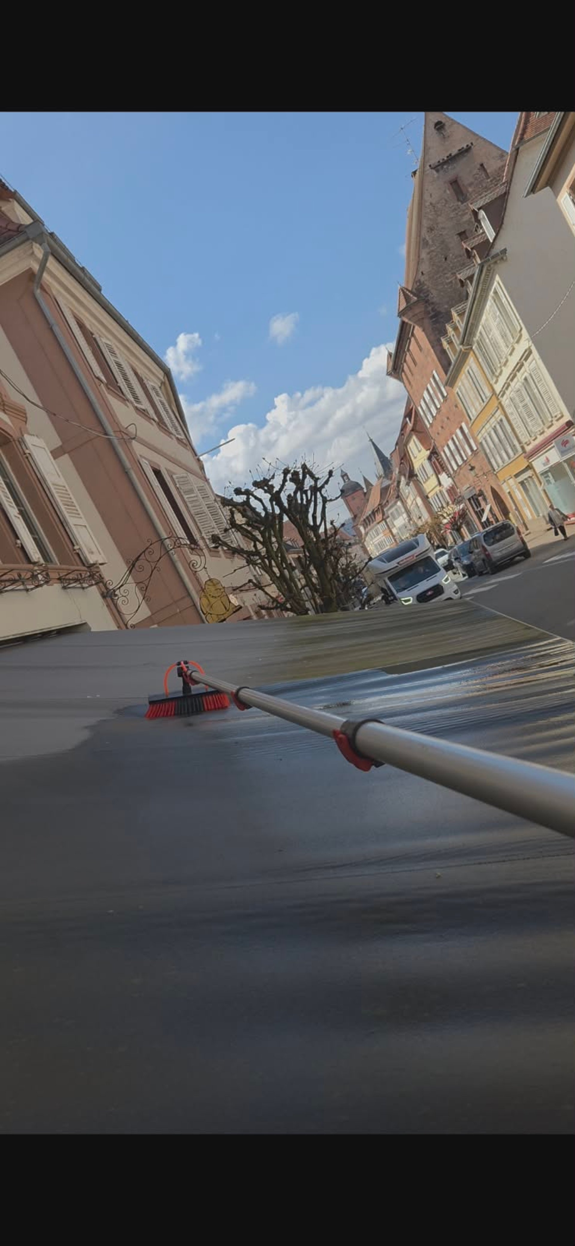 A person is drawing a picture on a window