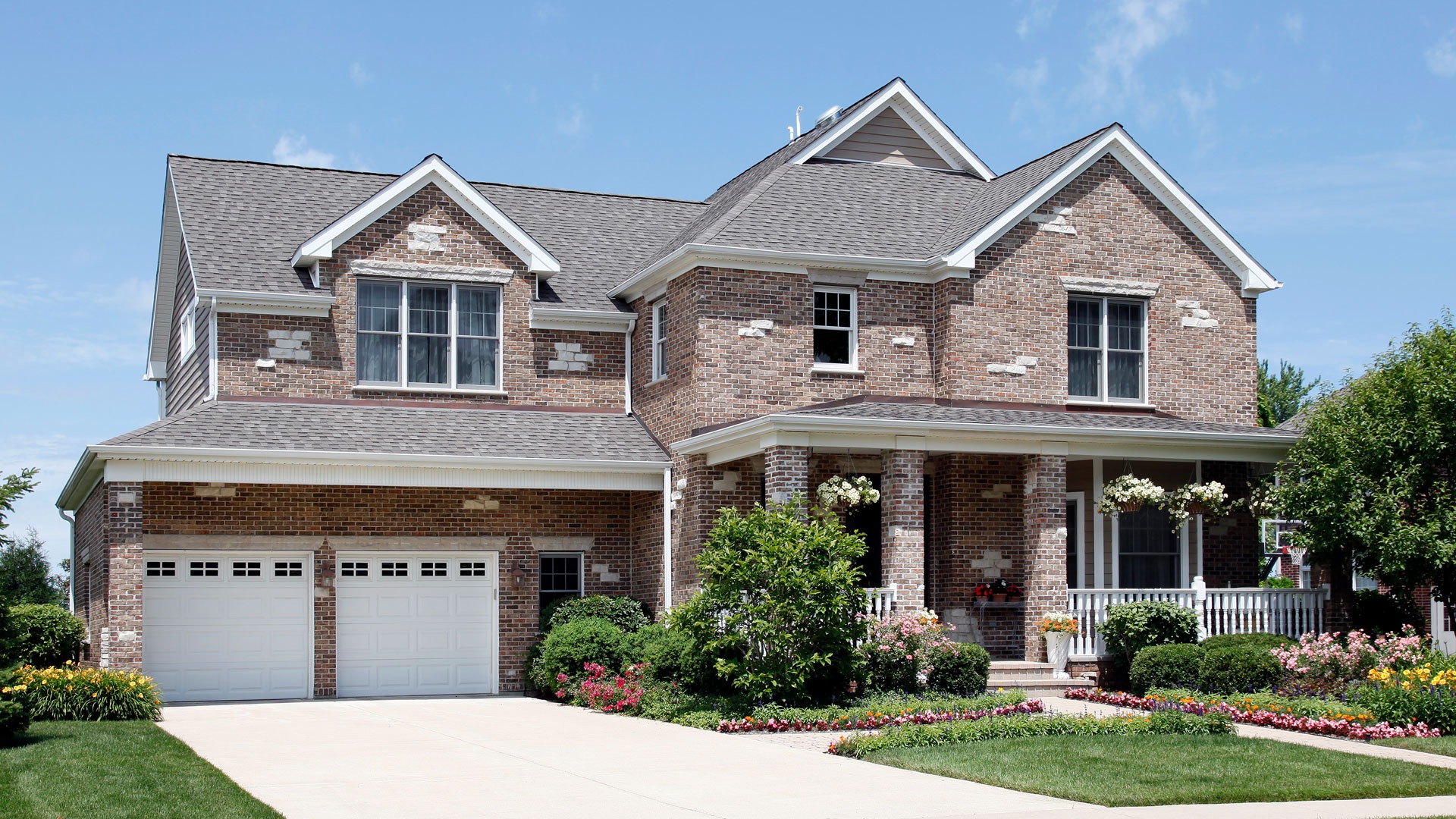 an abstract photo of a curved building with a blue sky in the background