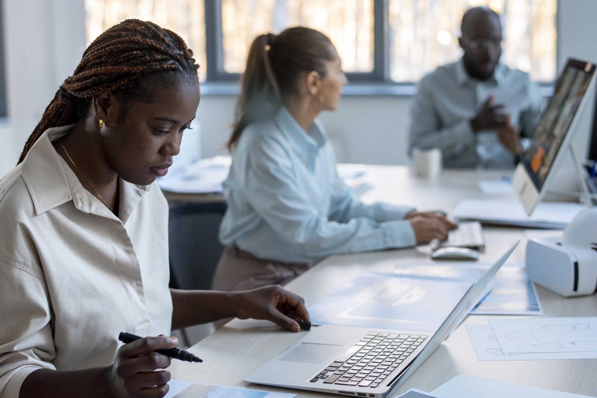 an abstract photo of a curved building with a blue sky in the background