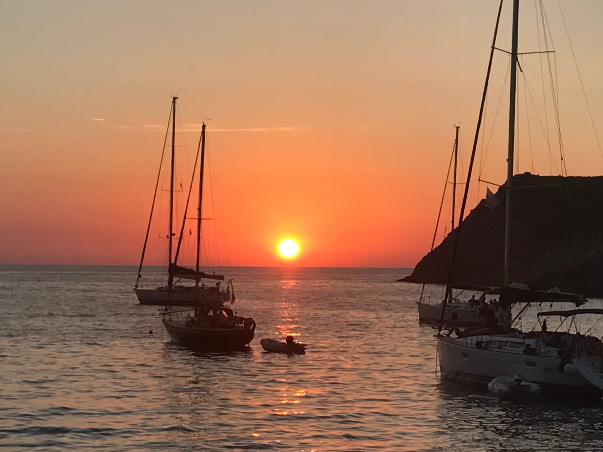 woman wearing yellow long-sleeved dress under white clouds and blue sky during daytime