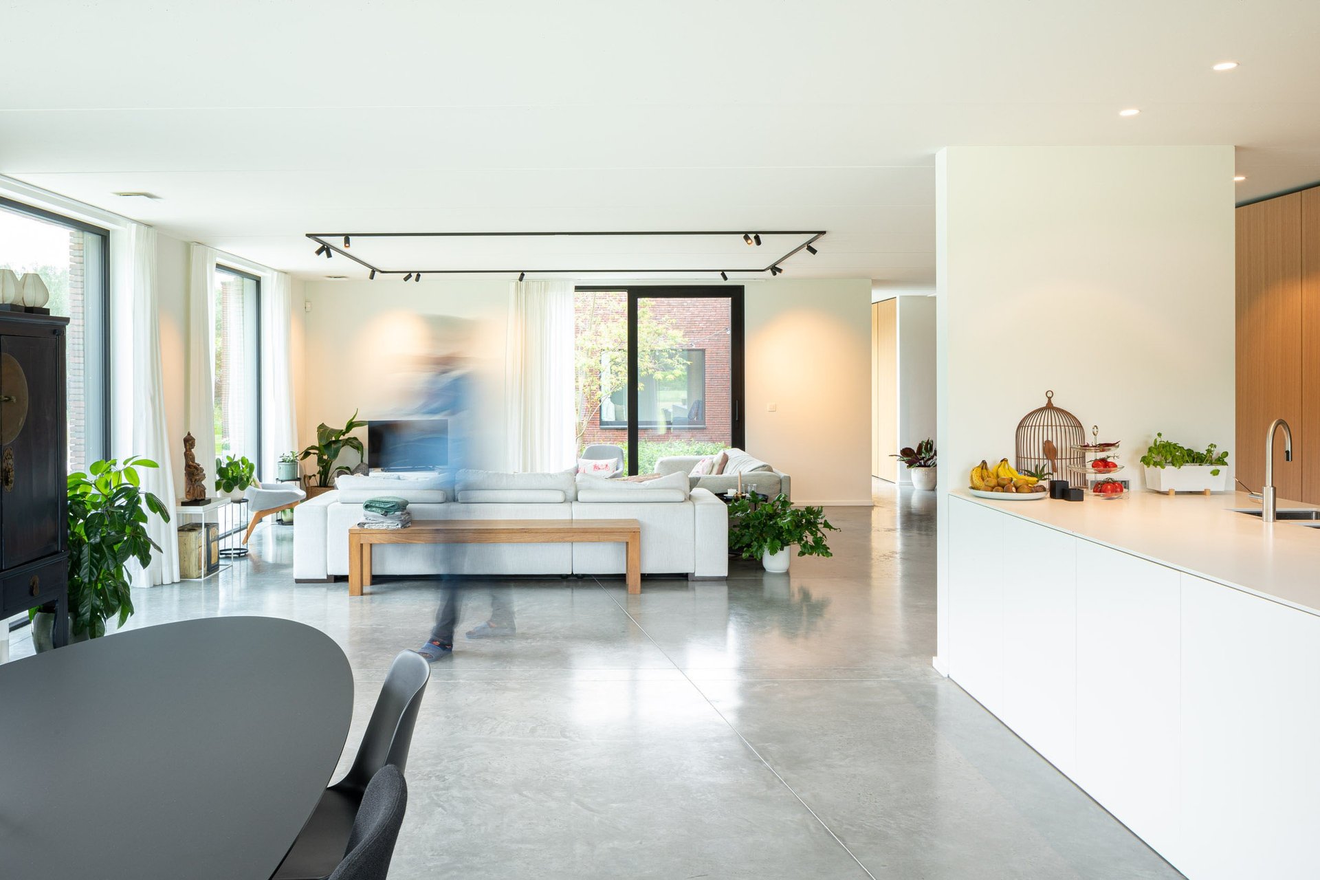an abstract photo of a curved building with a blue sky in the background