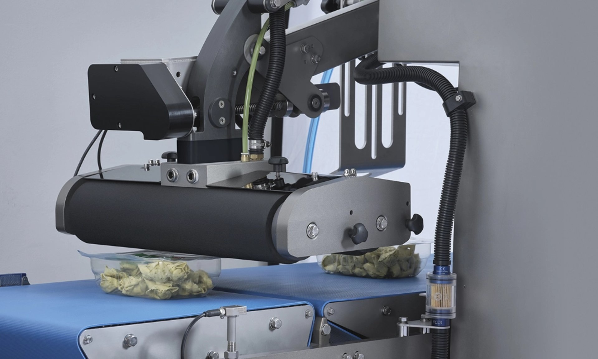 an abstract photo of a curved building with a blue sky in the background