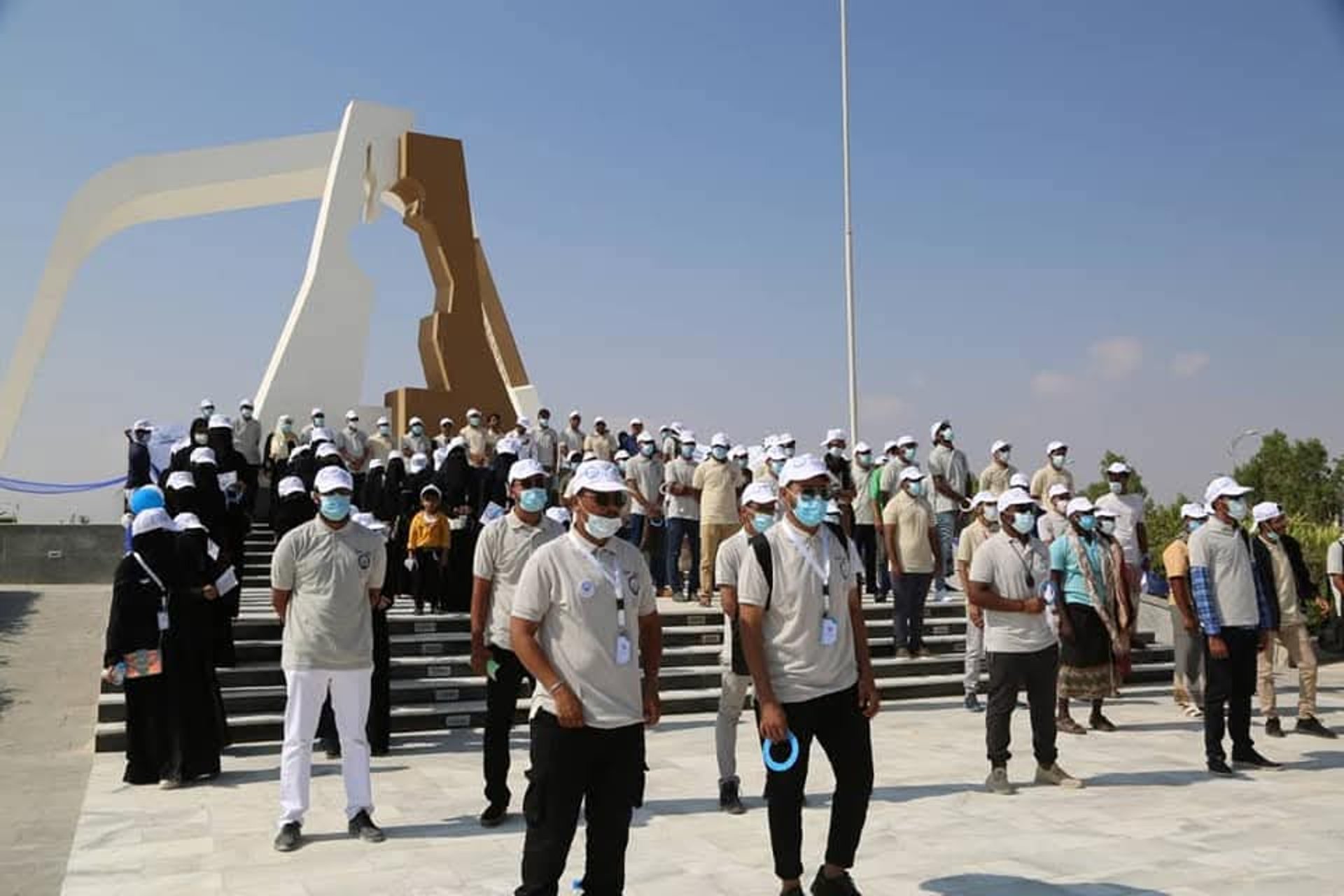 woman wearing yellow long-sleeved dress under white clouds and blue sky during daytime