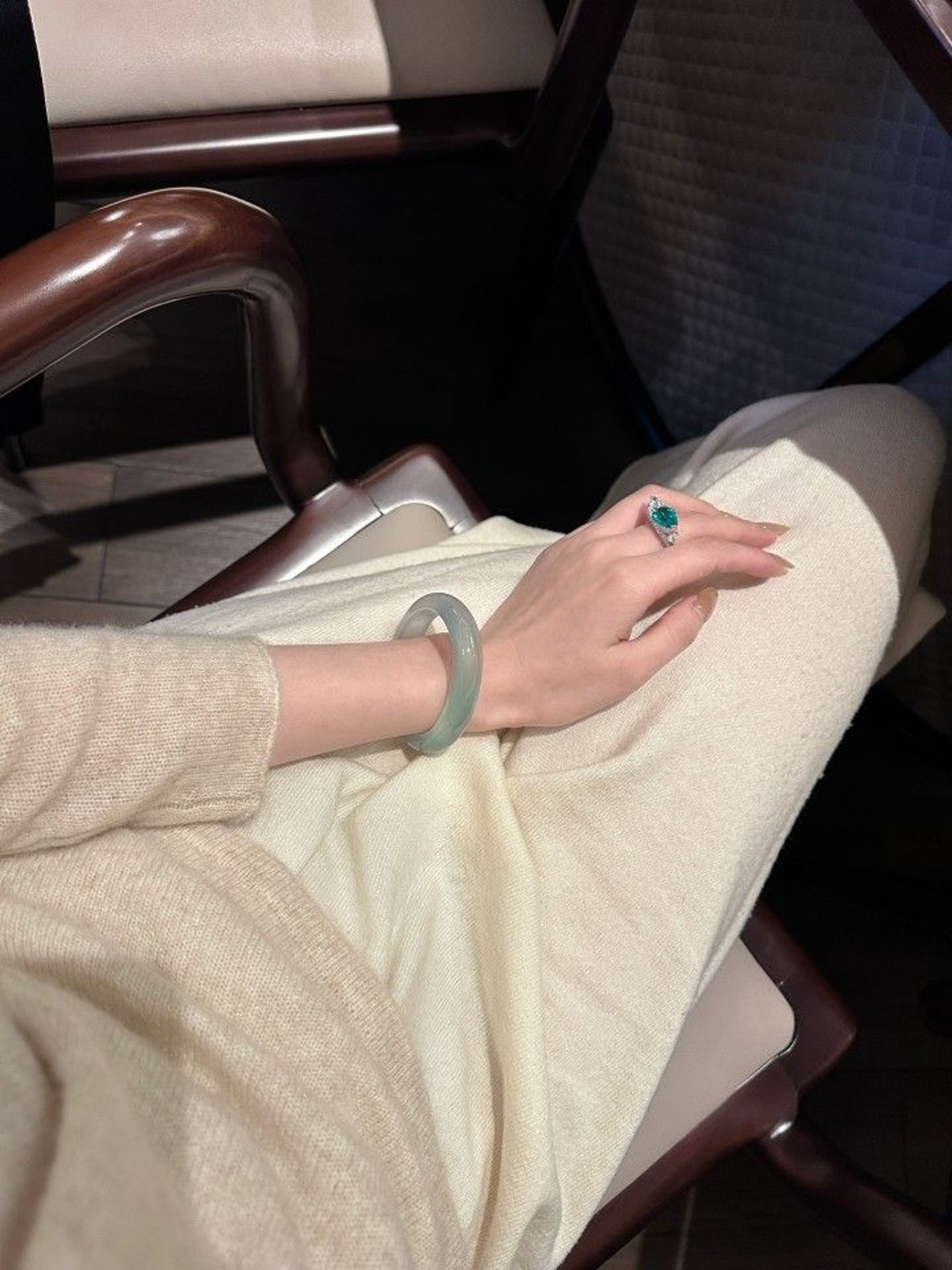 person wearing grey knit sweater