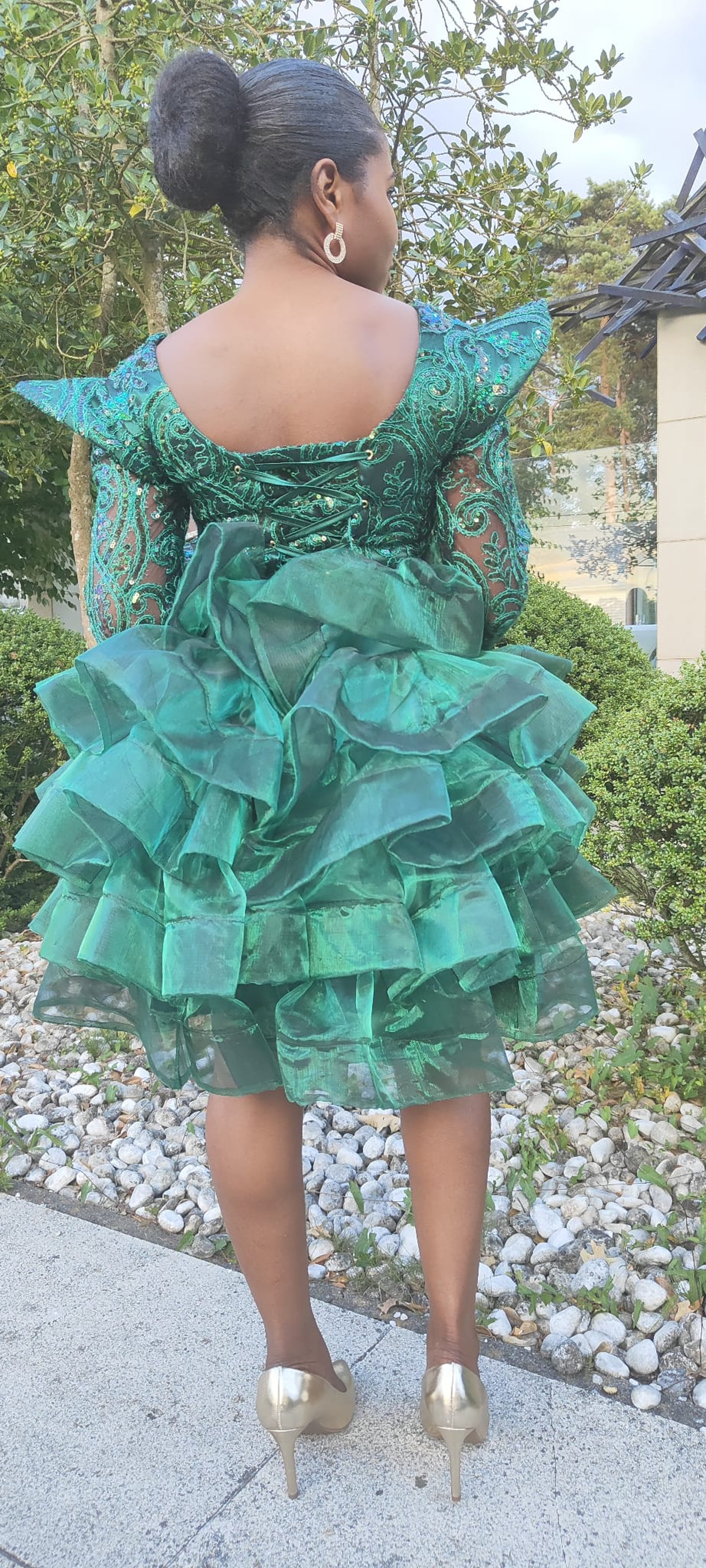 an abstract photo of a curved building with a blue sky in the background