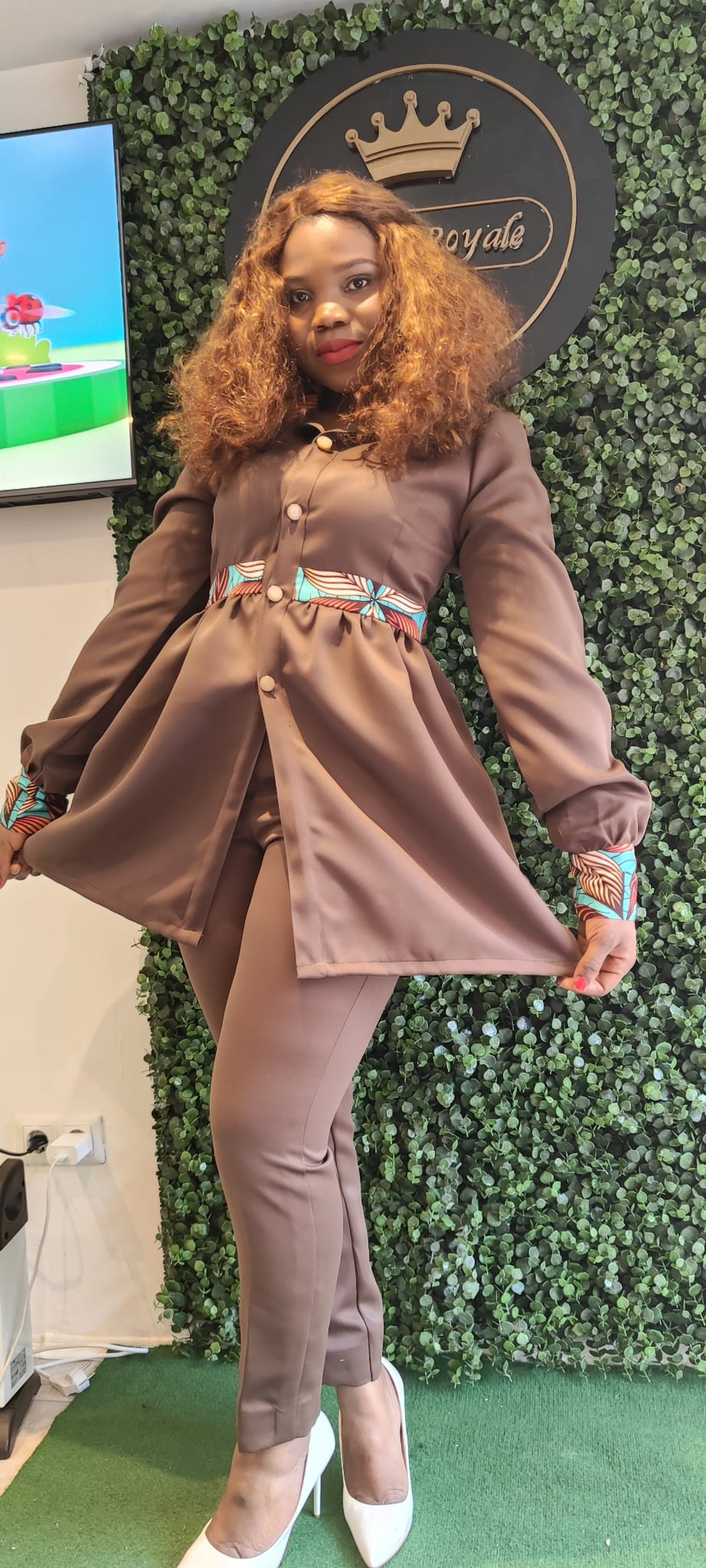 an abstract photo of a curved building with a blue sky in the background