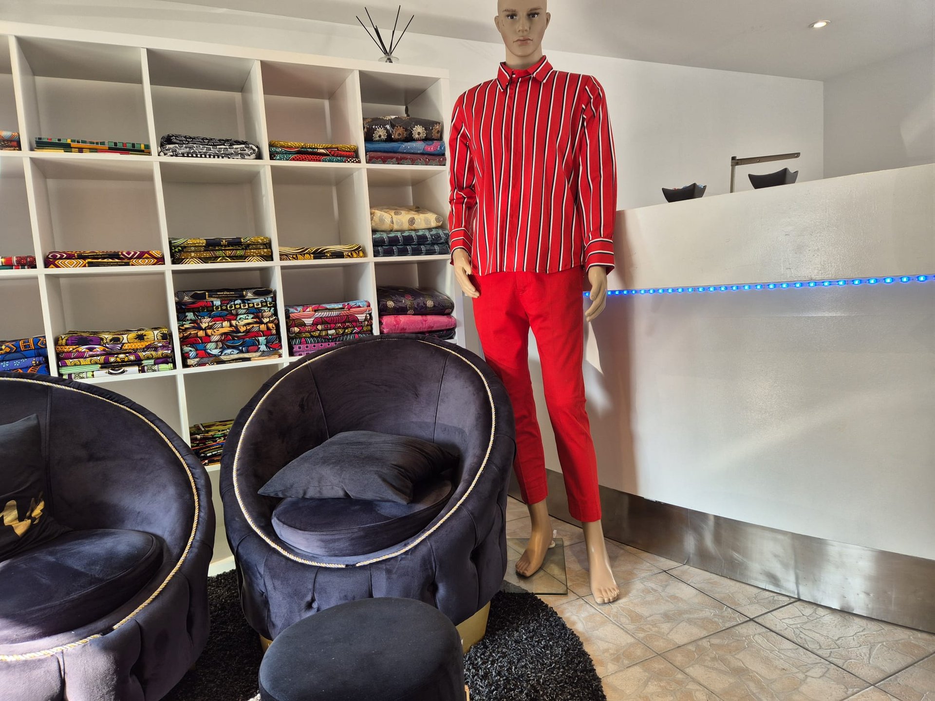 an abstract photo of a curved building with a blue sky in the background