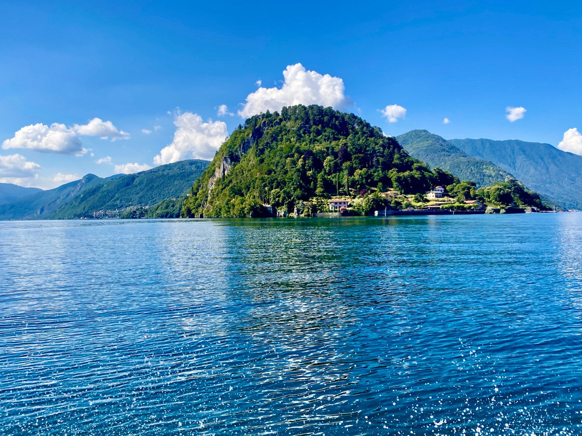 a bridge over a body of water with buildings around it