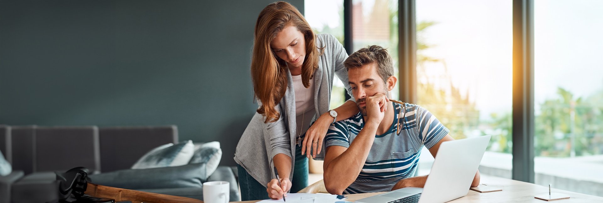 man in white dress shirt and woman in brown dress standing on green grass field during