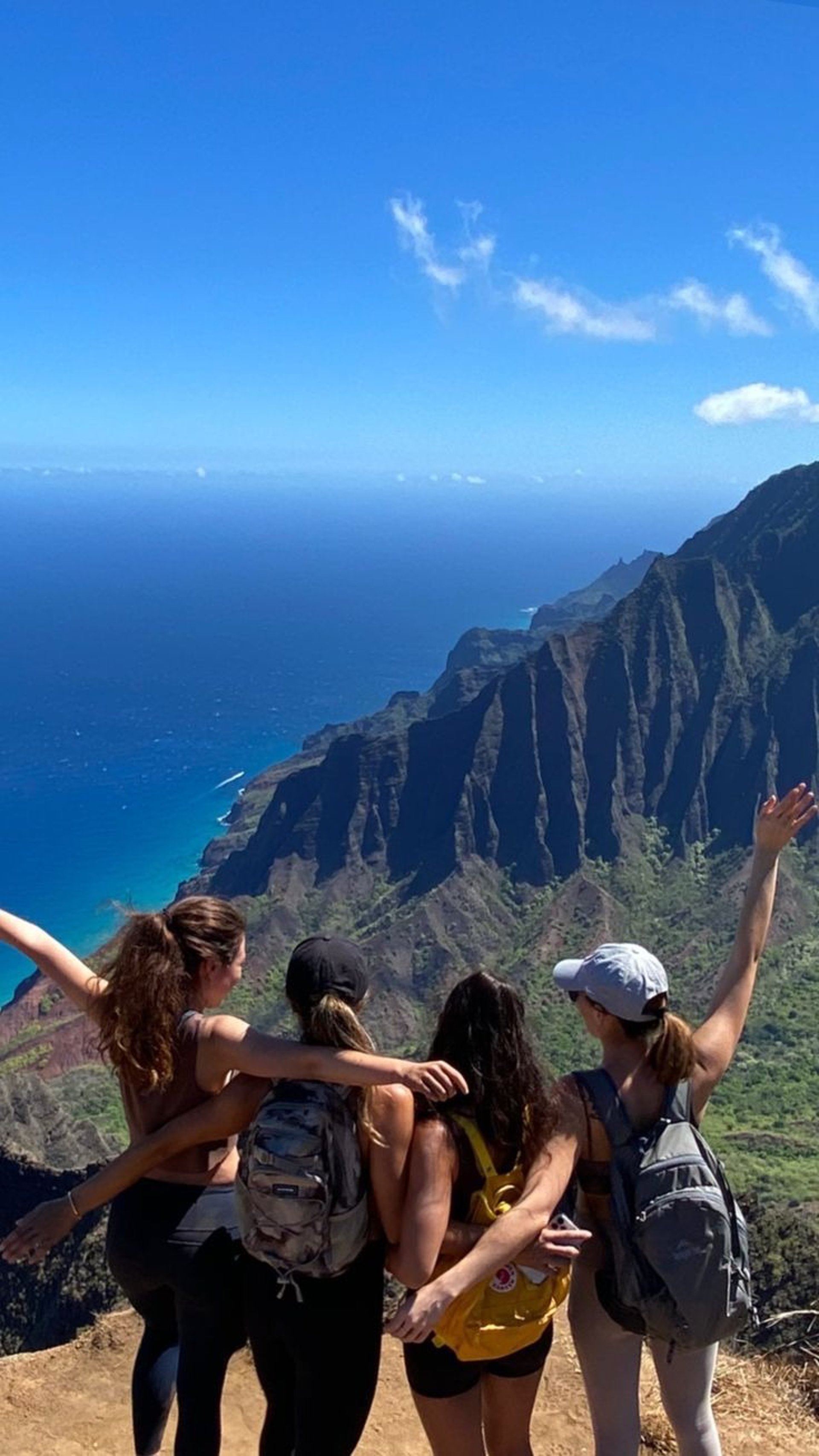 an abstract photo of a curved building with a blue sky in the background