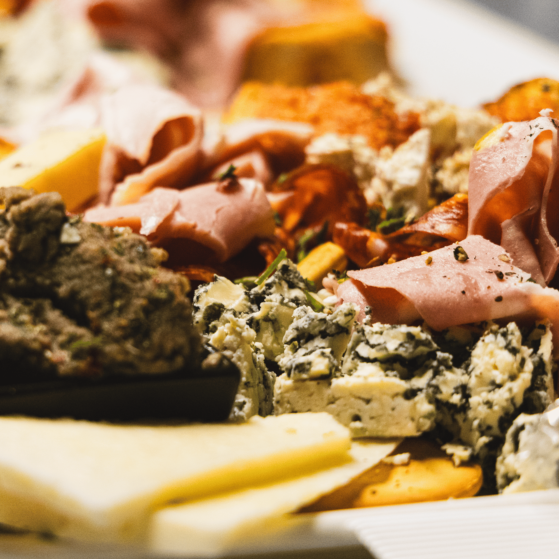 woman in black tank top holding clear wine glass