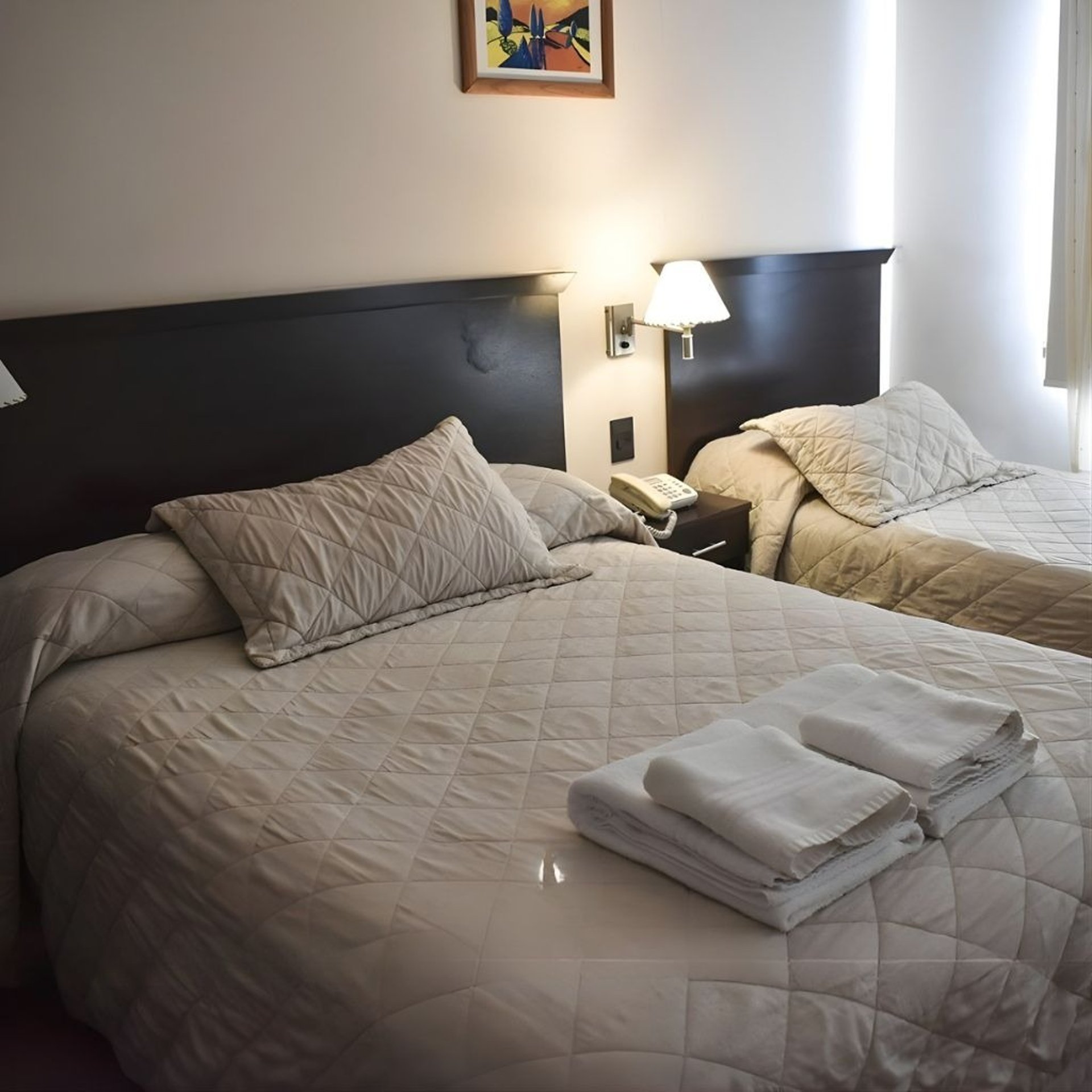 an abstract photo of a curved building with a blue sky in the background