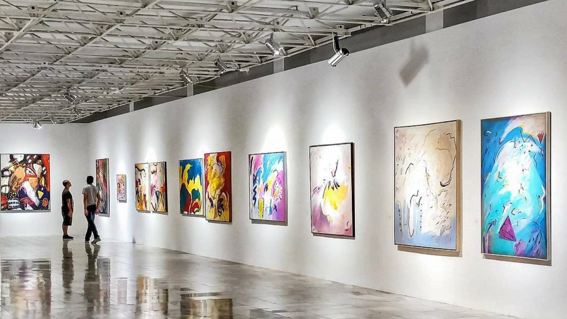 black and brown leather padded tub sofa