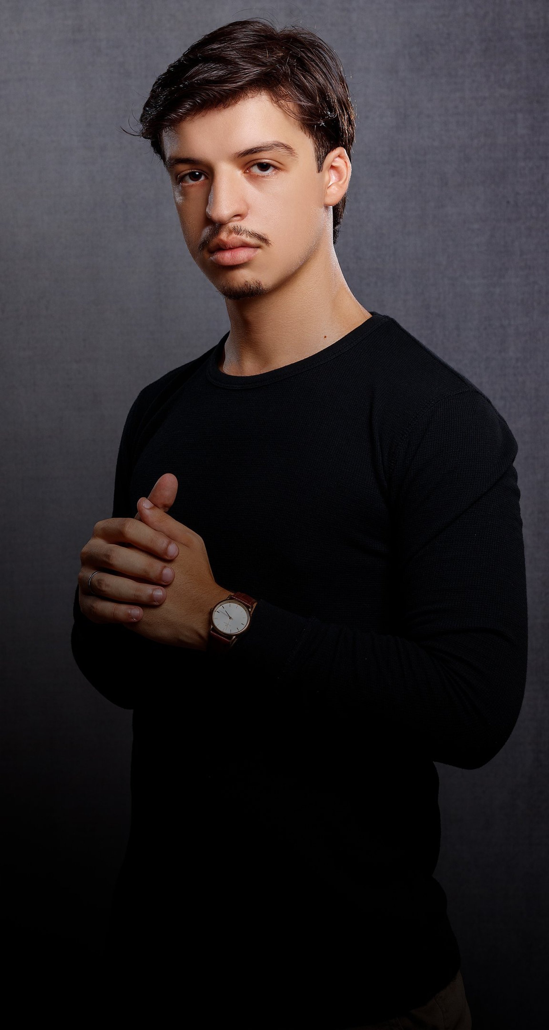 an abstract photo of a curved building with a blue sky in the background