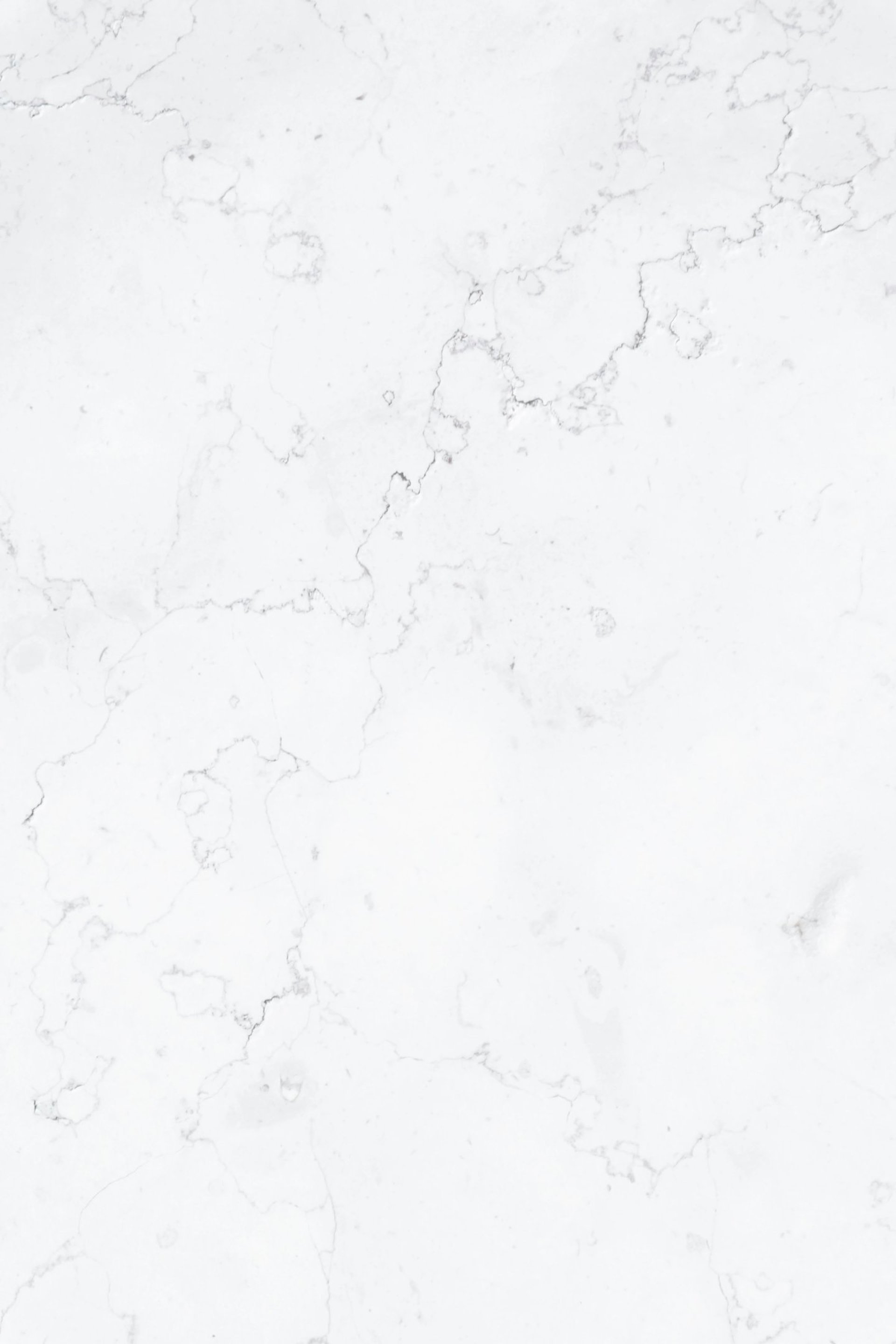 a close up of a white marble surface