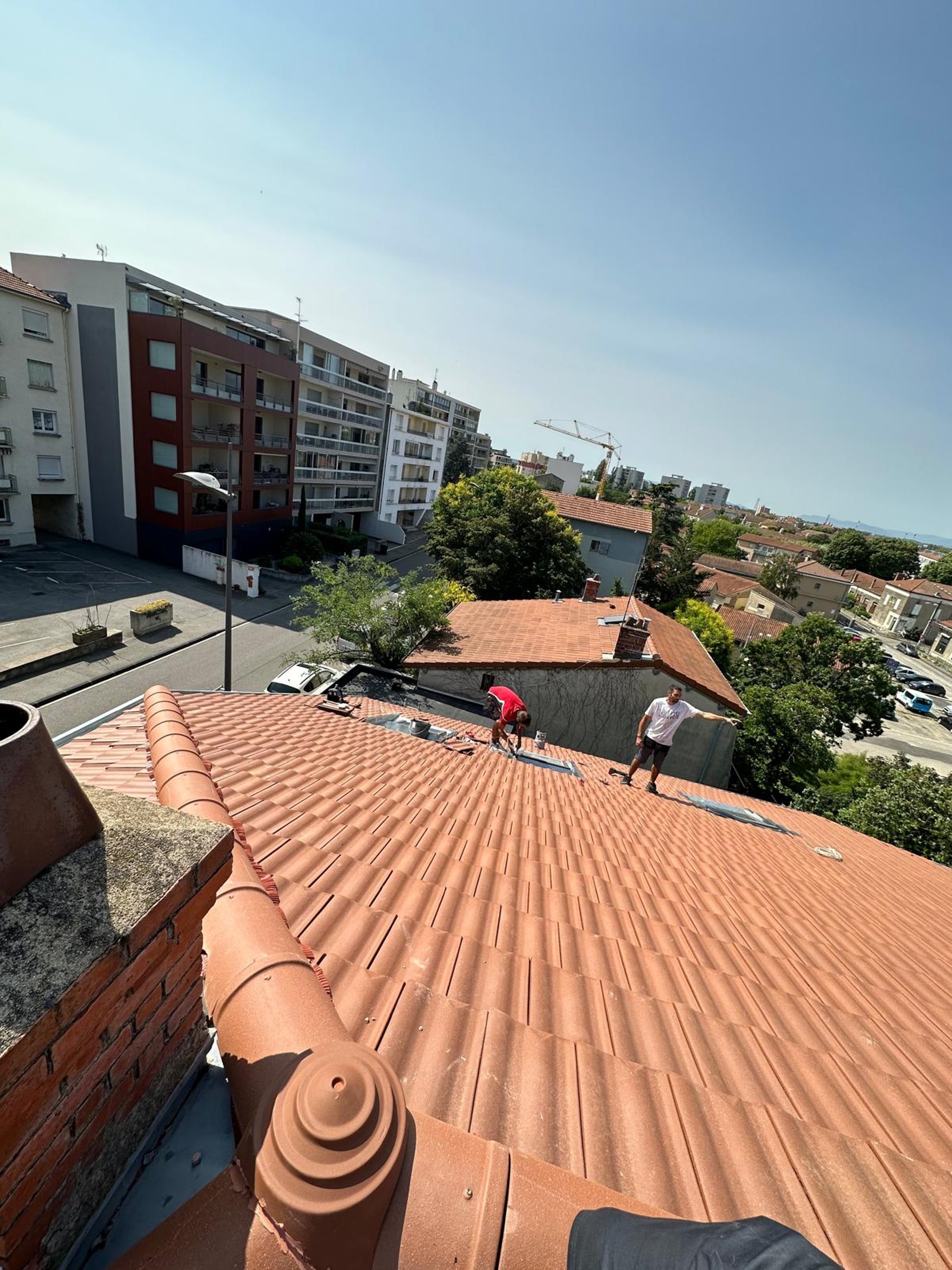 A man on a roof working on a roof