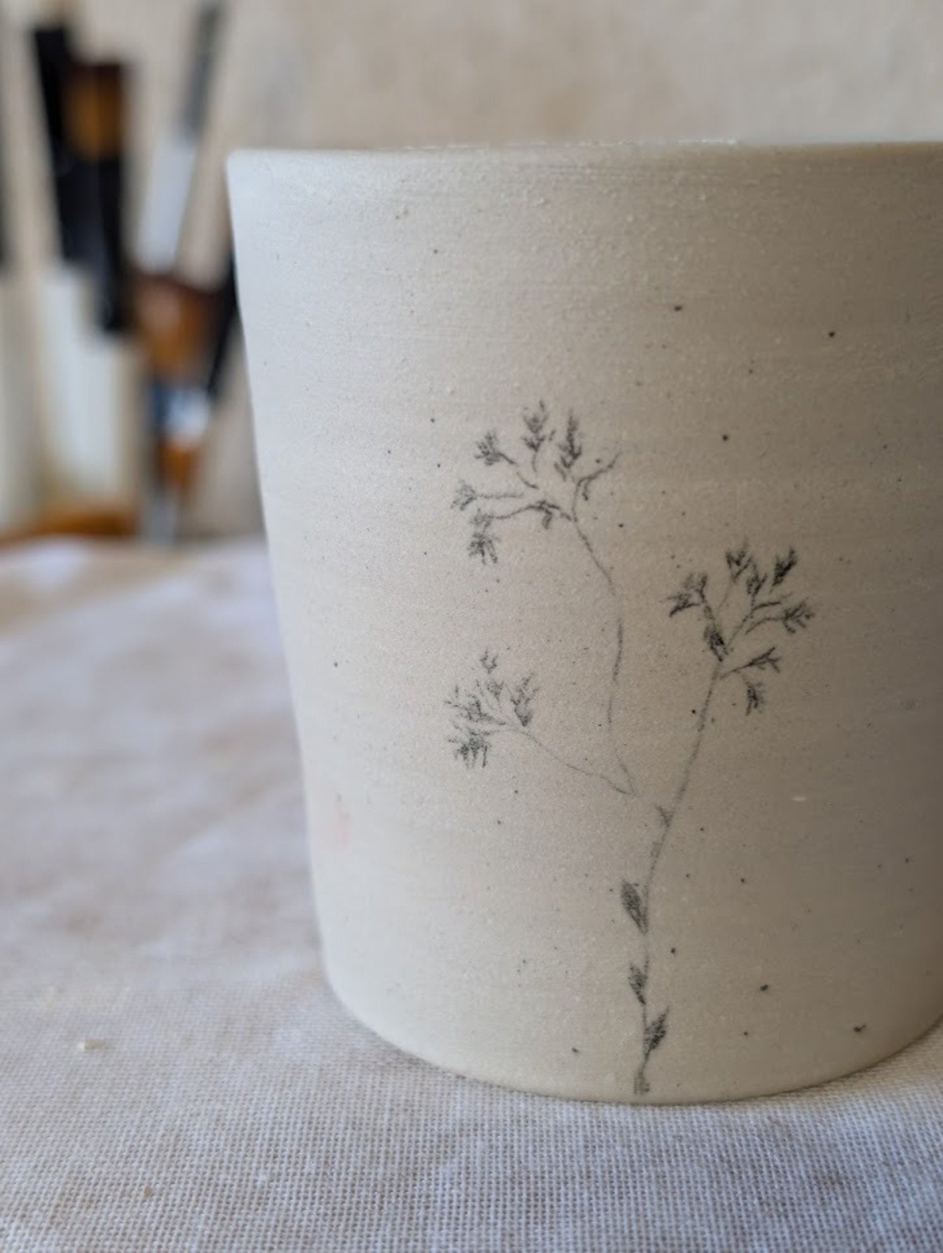 a woman is making a bowl on a table