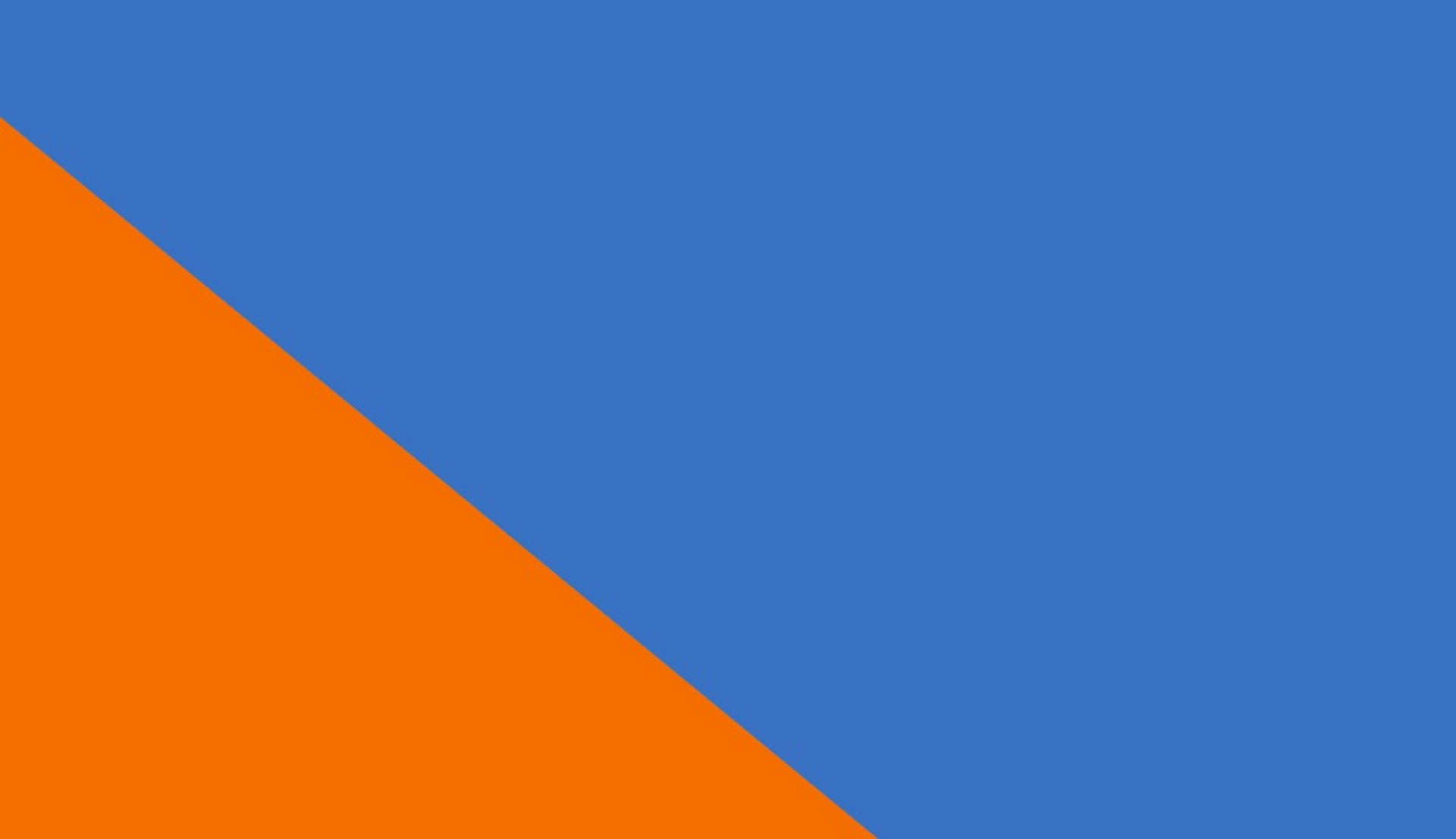 an abstract photo of a curved building with a blue sky in the background