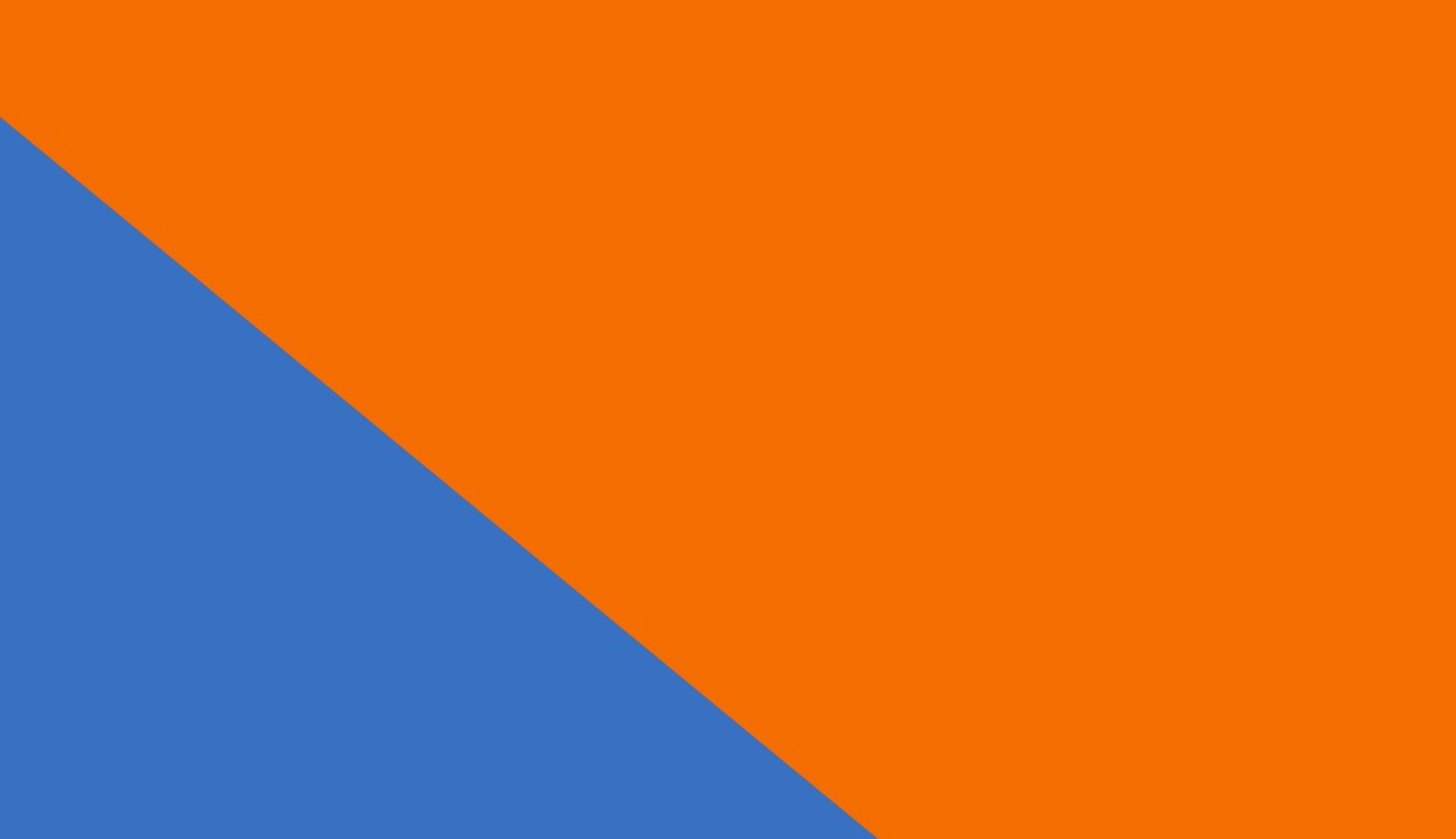 an abstract photo of a curved building with a blue sky in the background