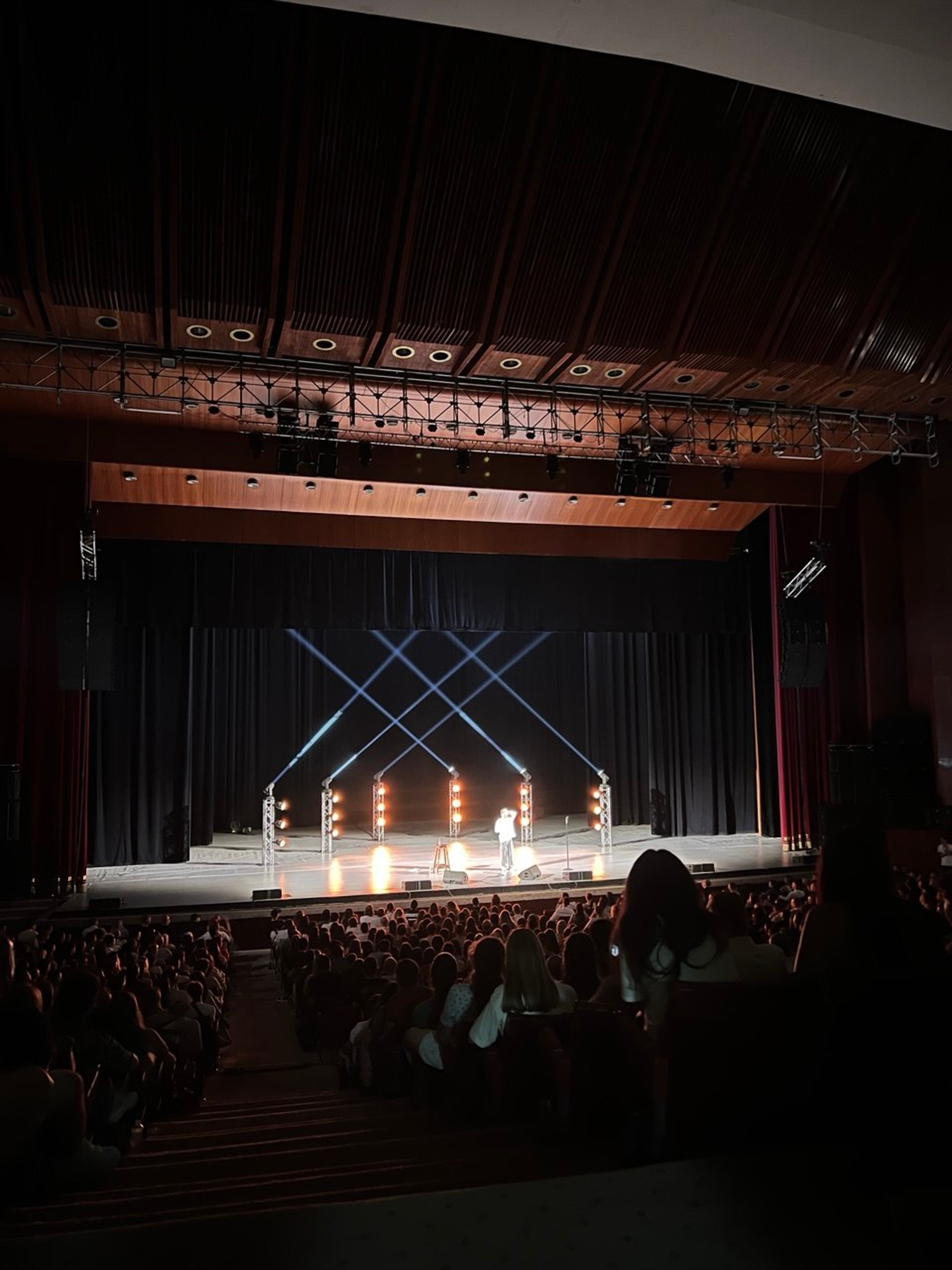 an abstract photo of a curved building with a blue sky in the background