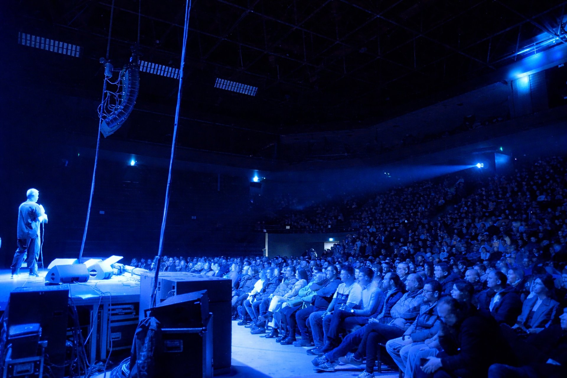 an abstract photo of a curved building with a blue sky in the background