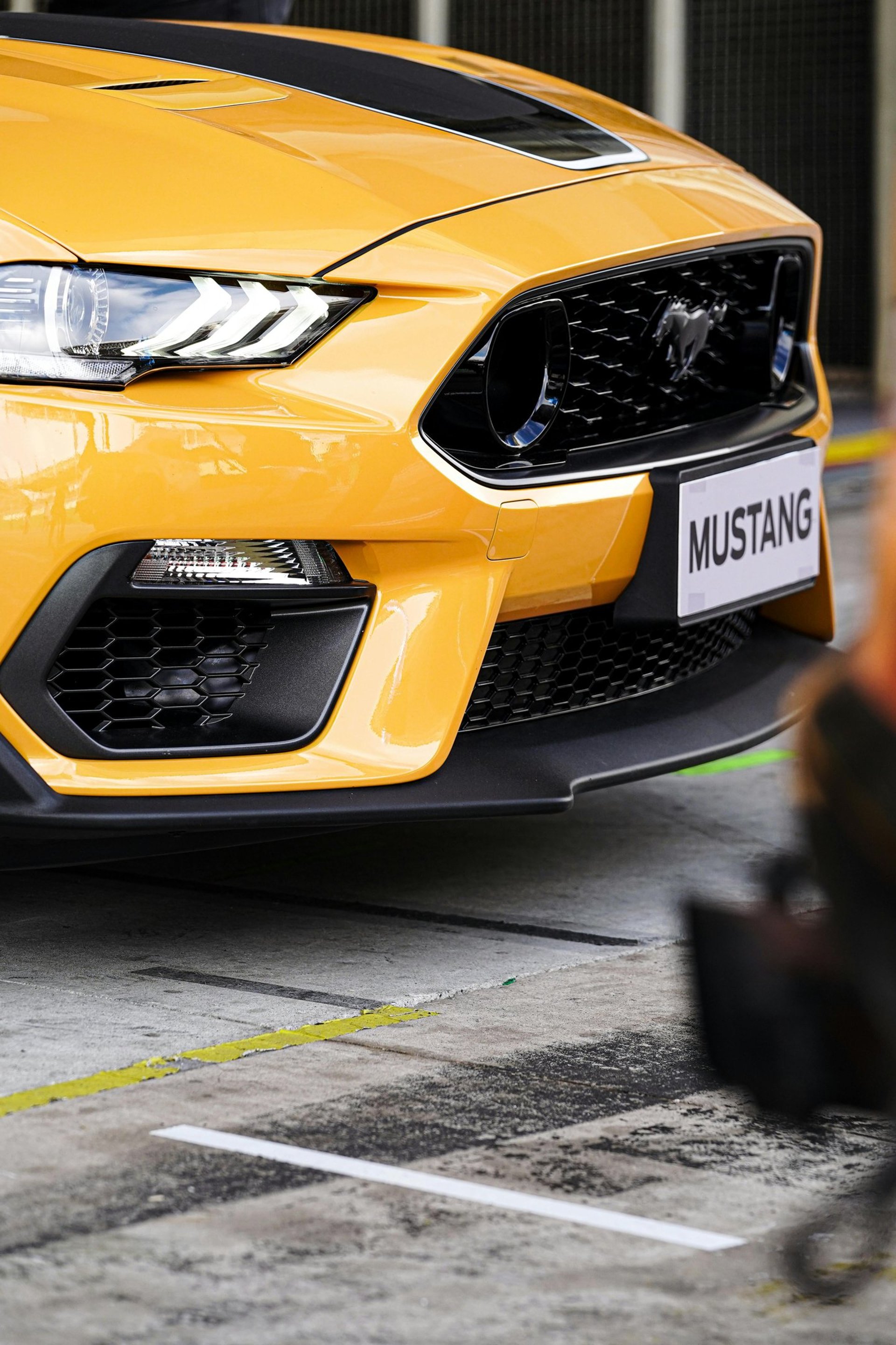 an abstract photo of a curved building with a blue sky in the background