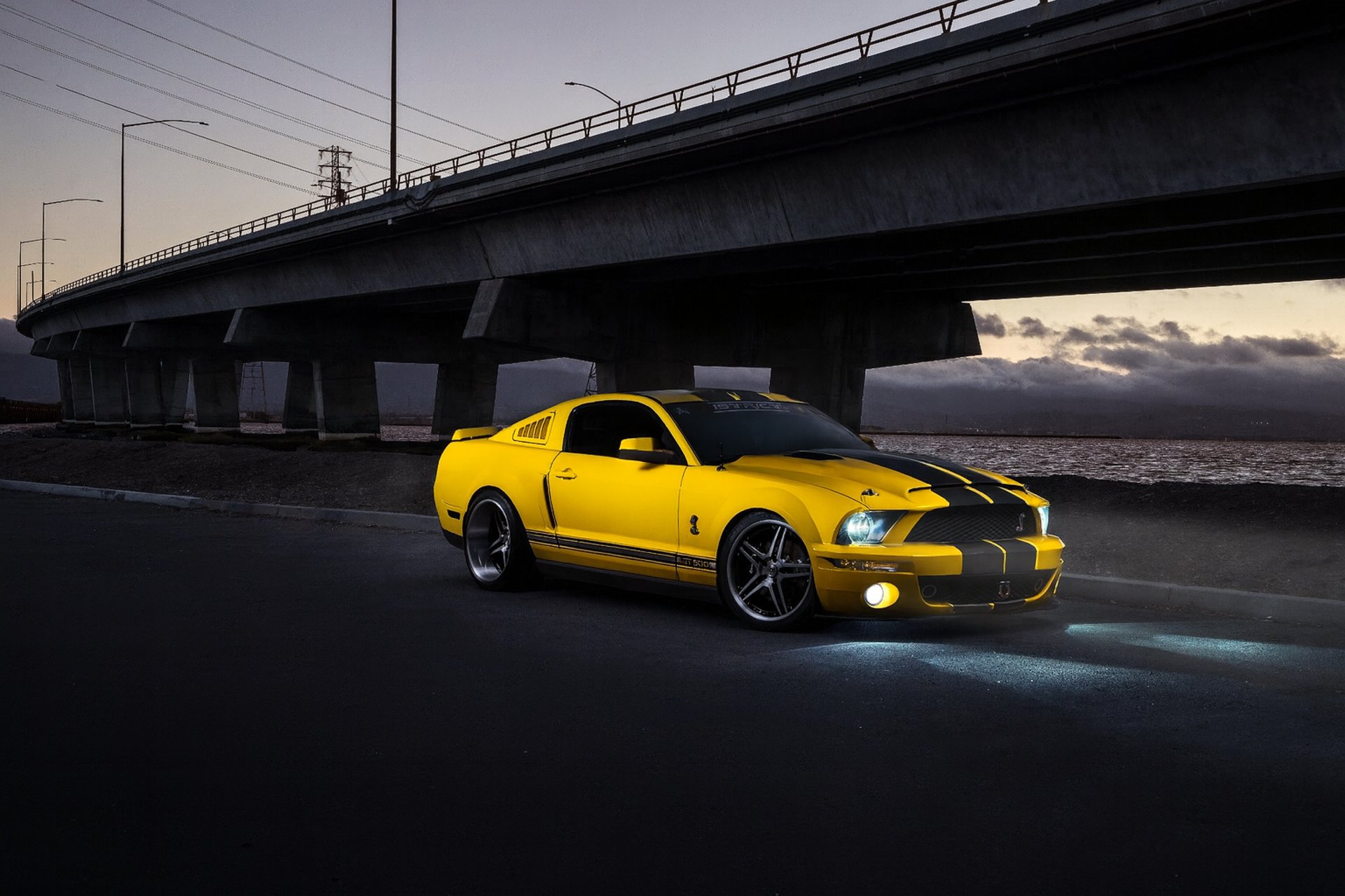 an abstract photo of a curved building with a blue sky in the background