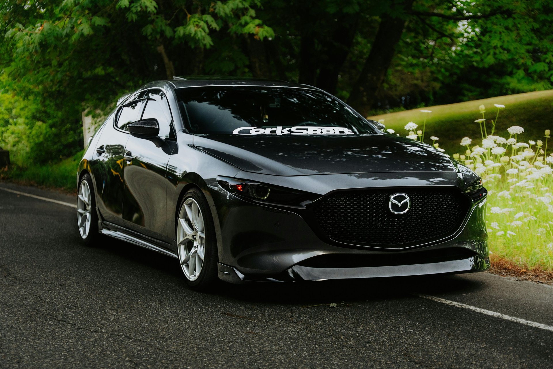an abstract photo of a curved building with a blue sky in the background
