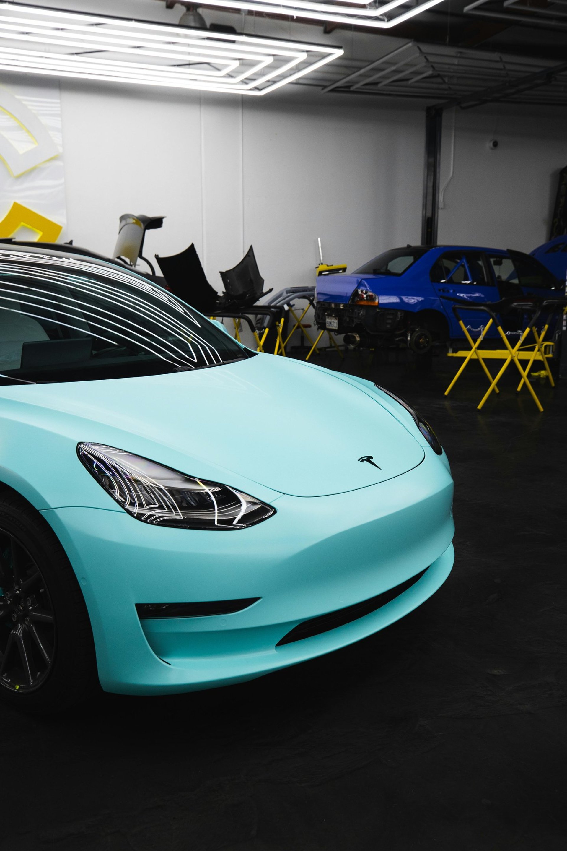 an abstract photo of a curved building with a blue sky in the background