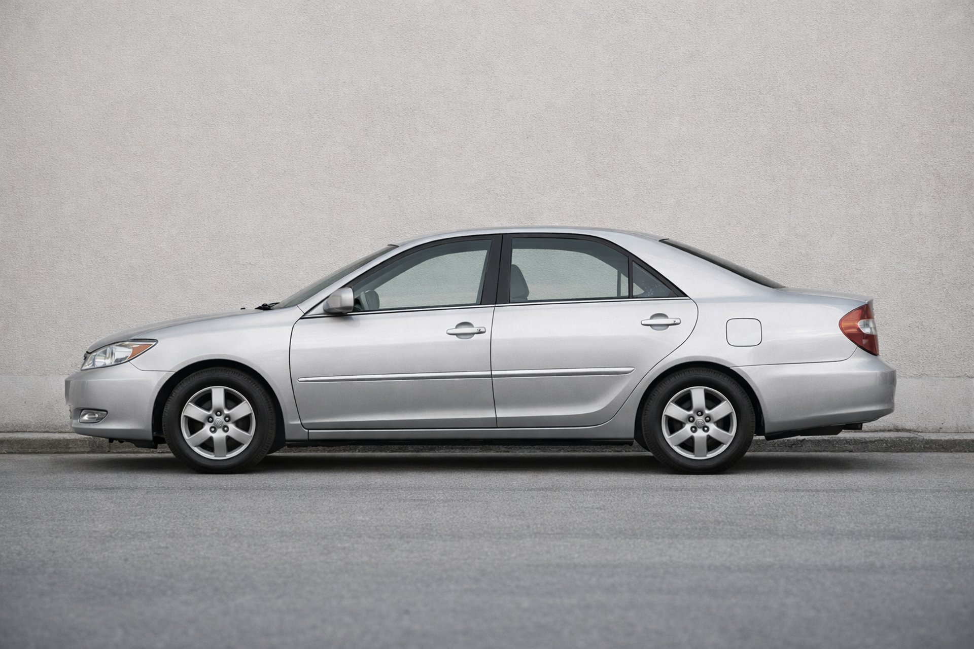 an abstract photo of a curved building with a blue sky in the background