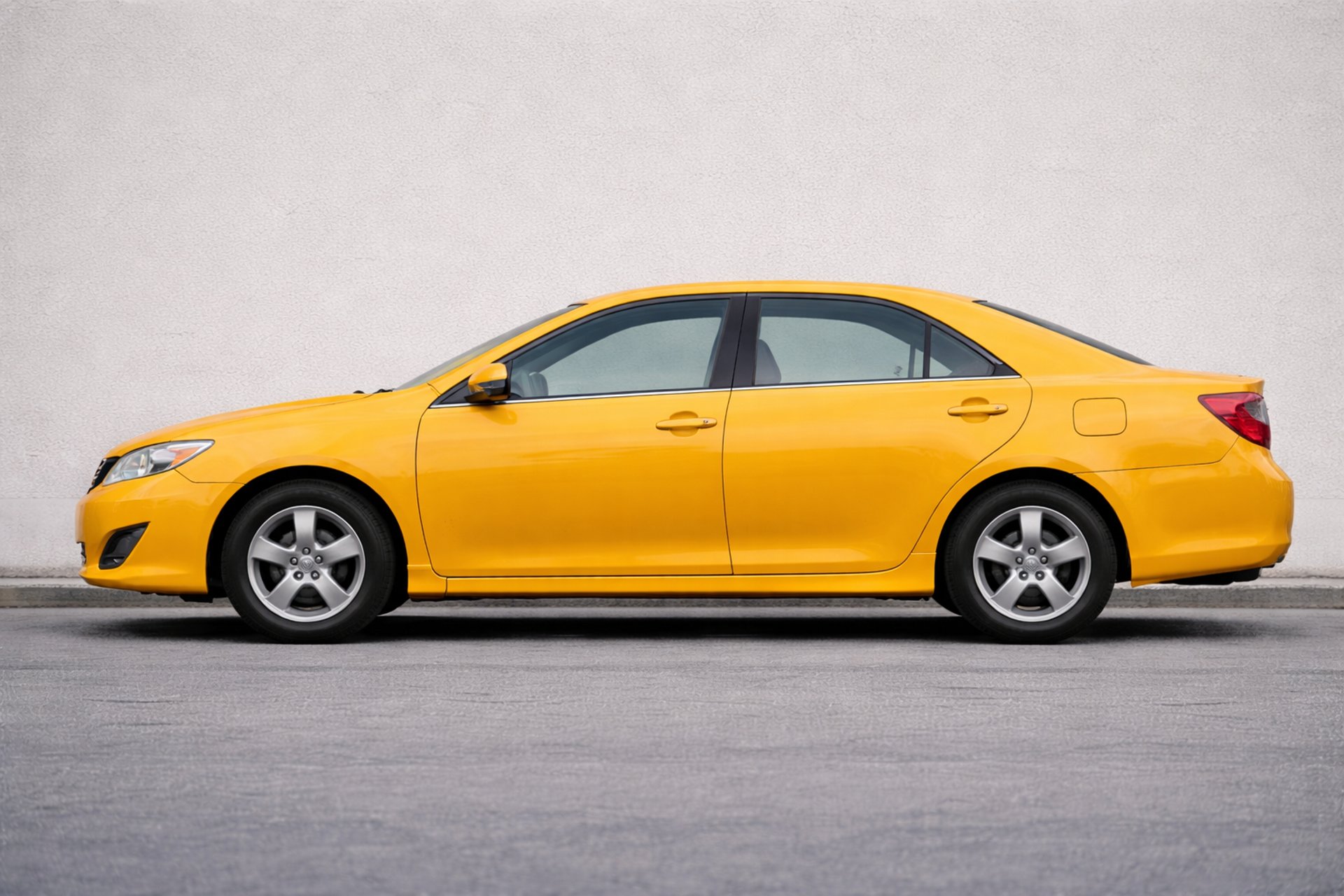 an abstract photo of a curved building with a blue sky in the background