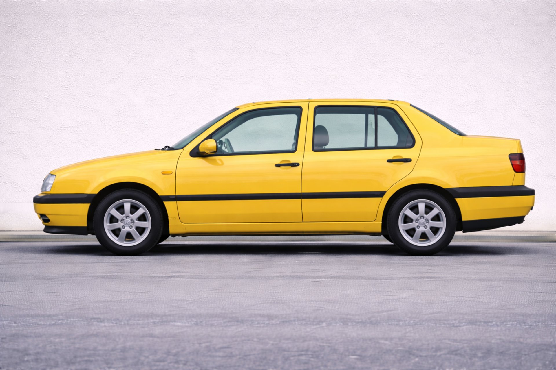 an abstract photo of a curved building with a blue sky in the background