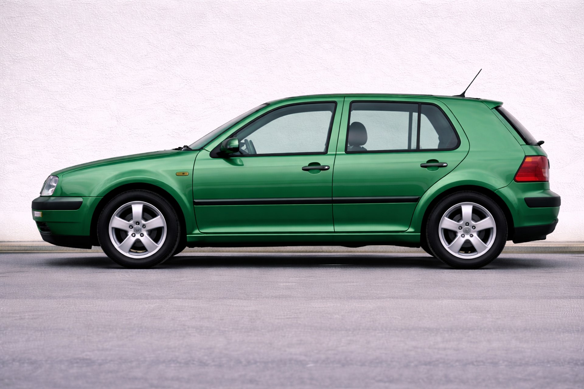 an abstract photo of a curved building with a blue sky in the background