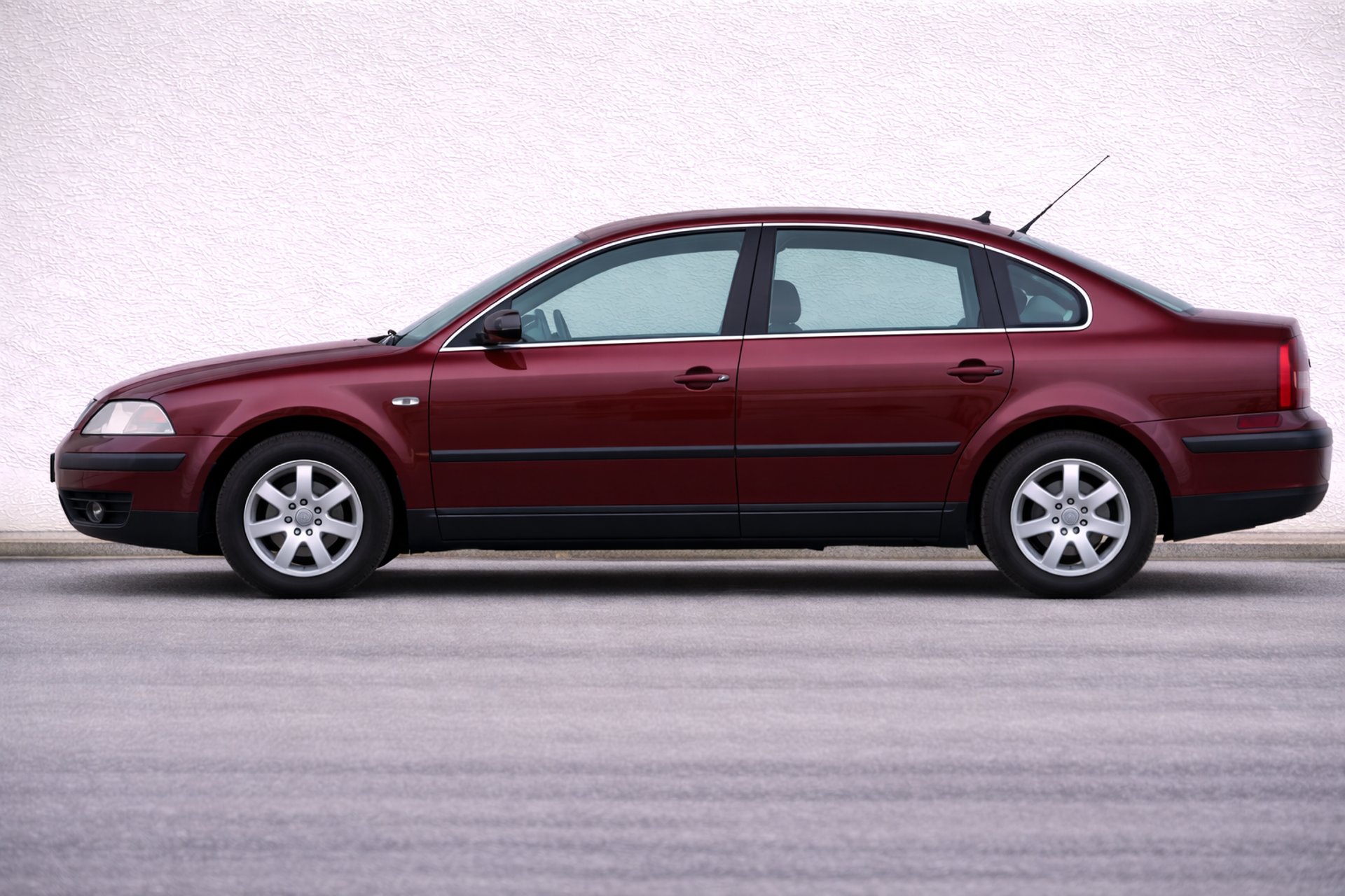 an abstract photo of a curved building with a blue sky in the background