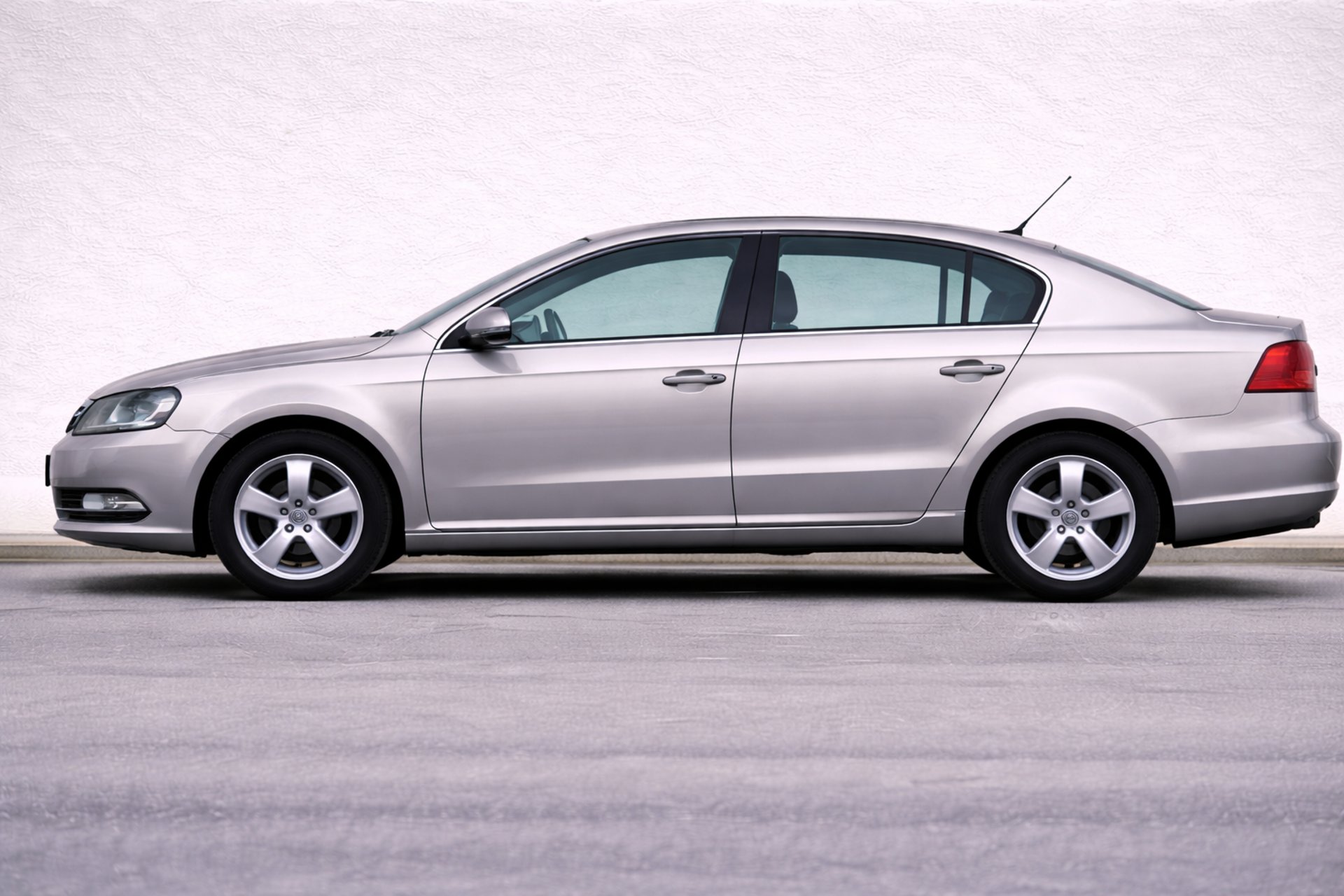 an abstract photo of a curved building with a blue sky in the background
