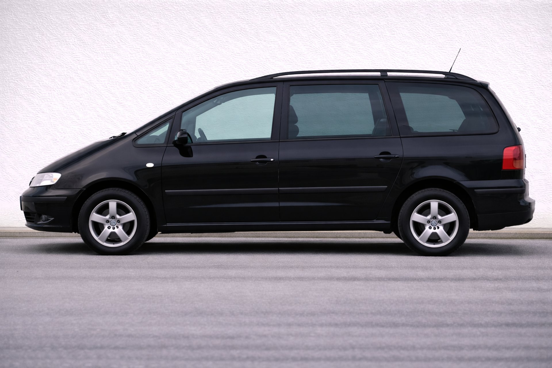 an abstract photo of a curved building with a blue sky in the background