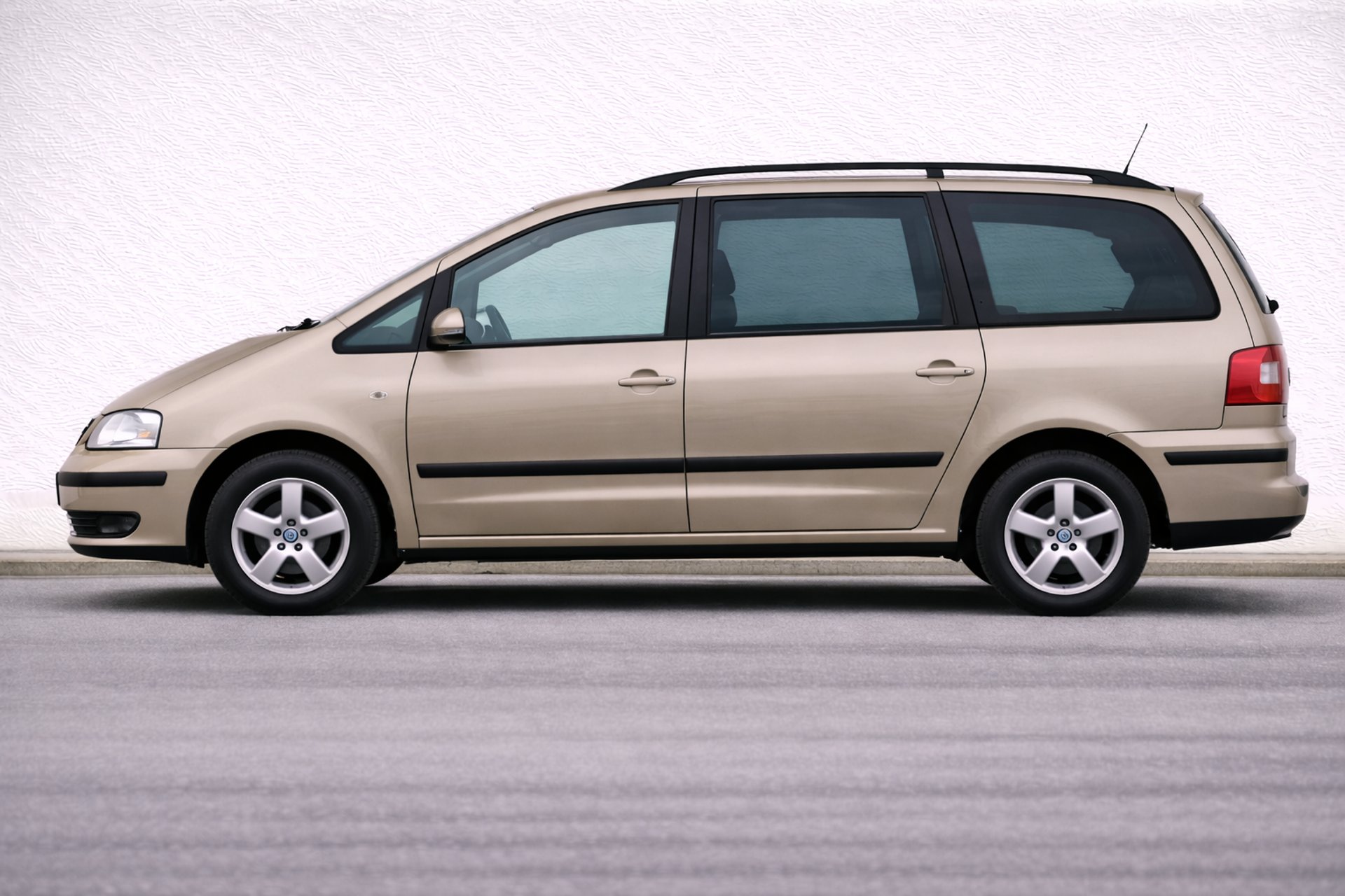 an abstract photo of a curved building with a blue sky in the background
