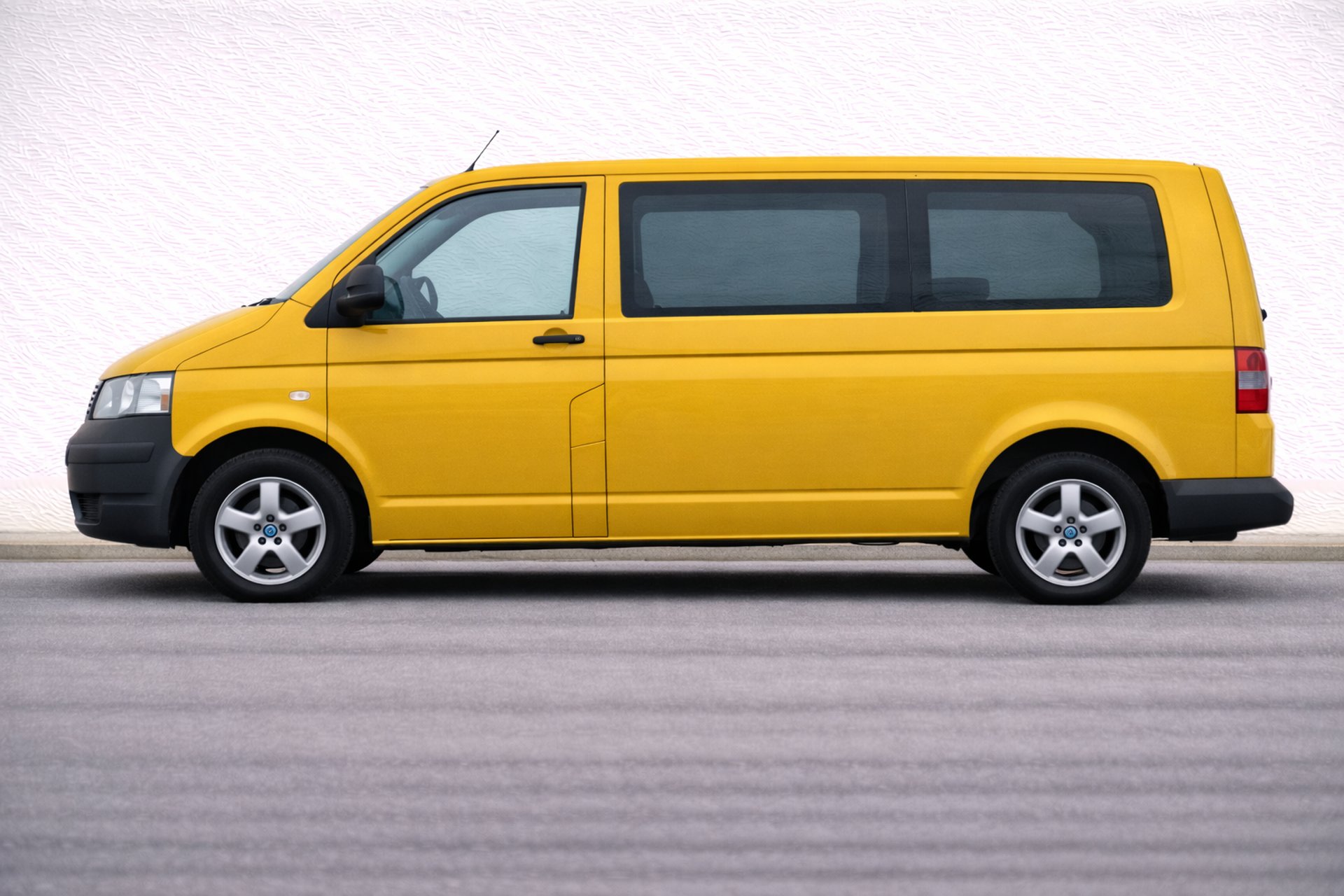 an abstract photo of a curved building with a blue sky in the background