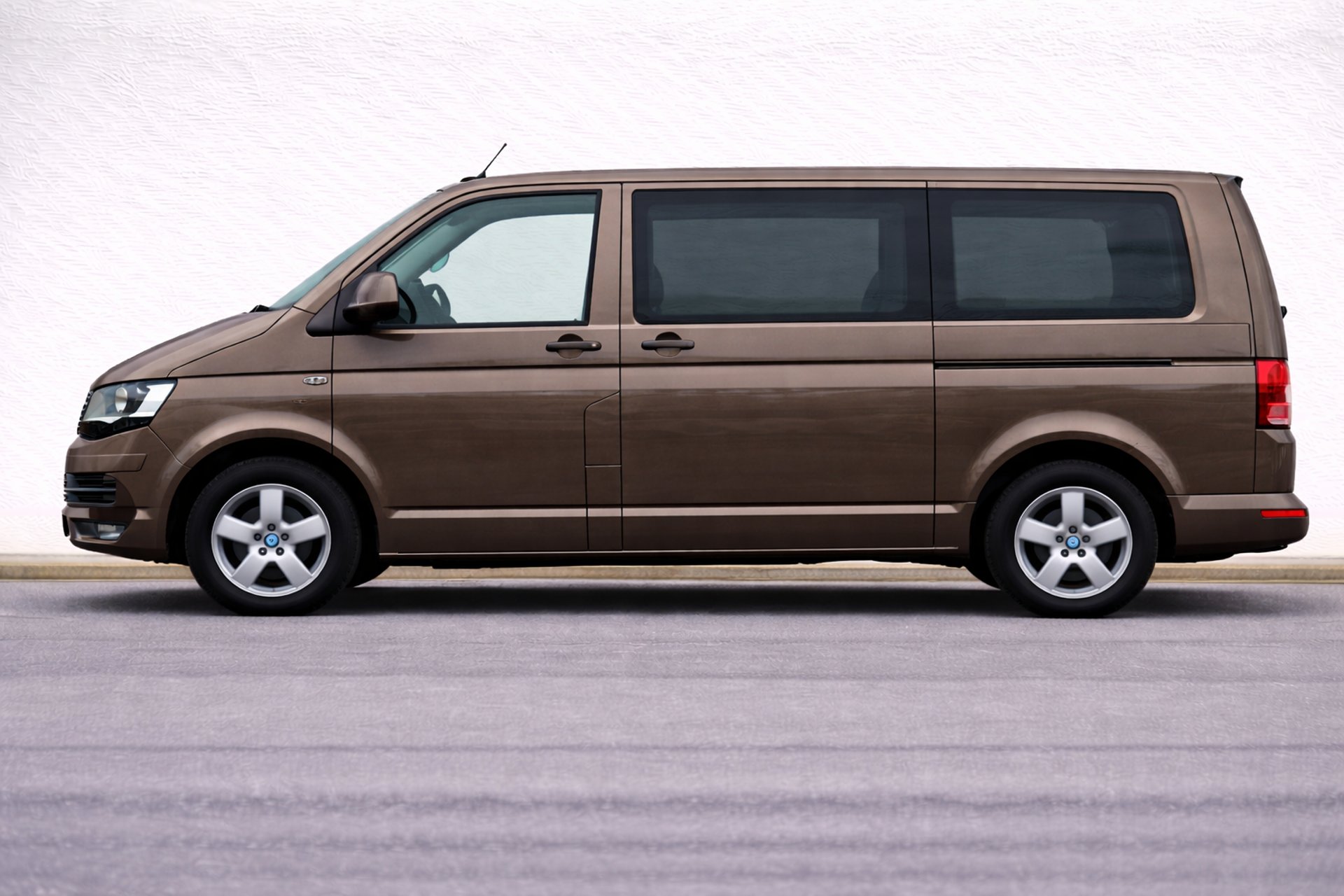 an abstract photo of a curved building with a blue sky in the background