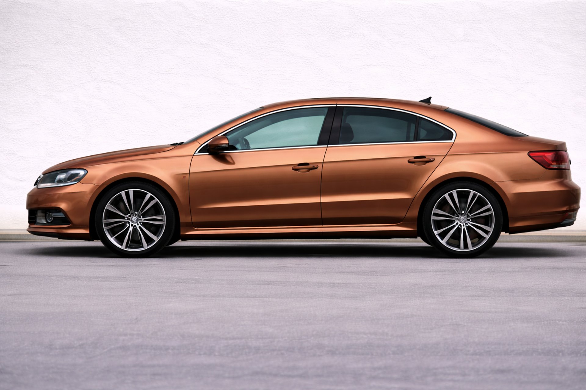 an abstract photo of a curved building with a blue sky in the background