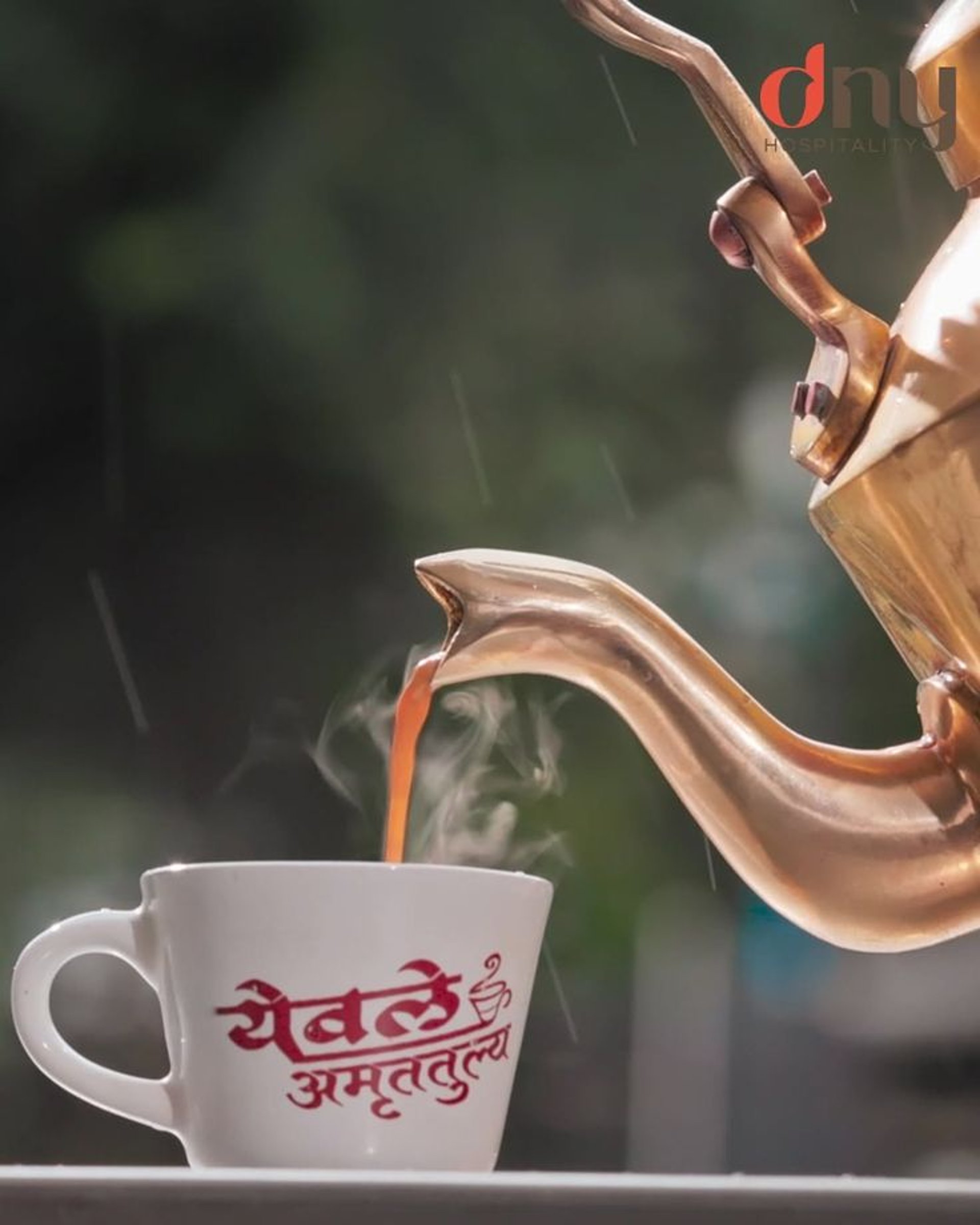 stainless steel teapot on table