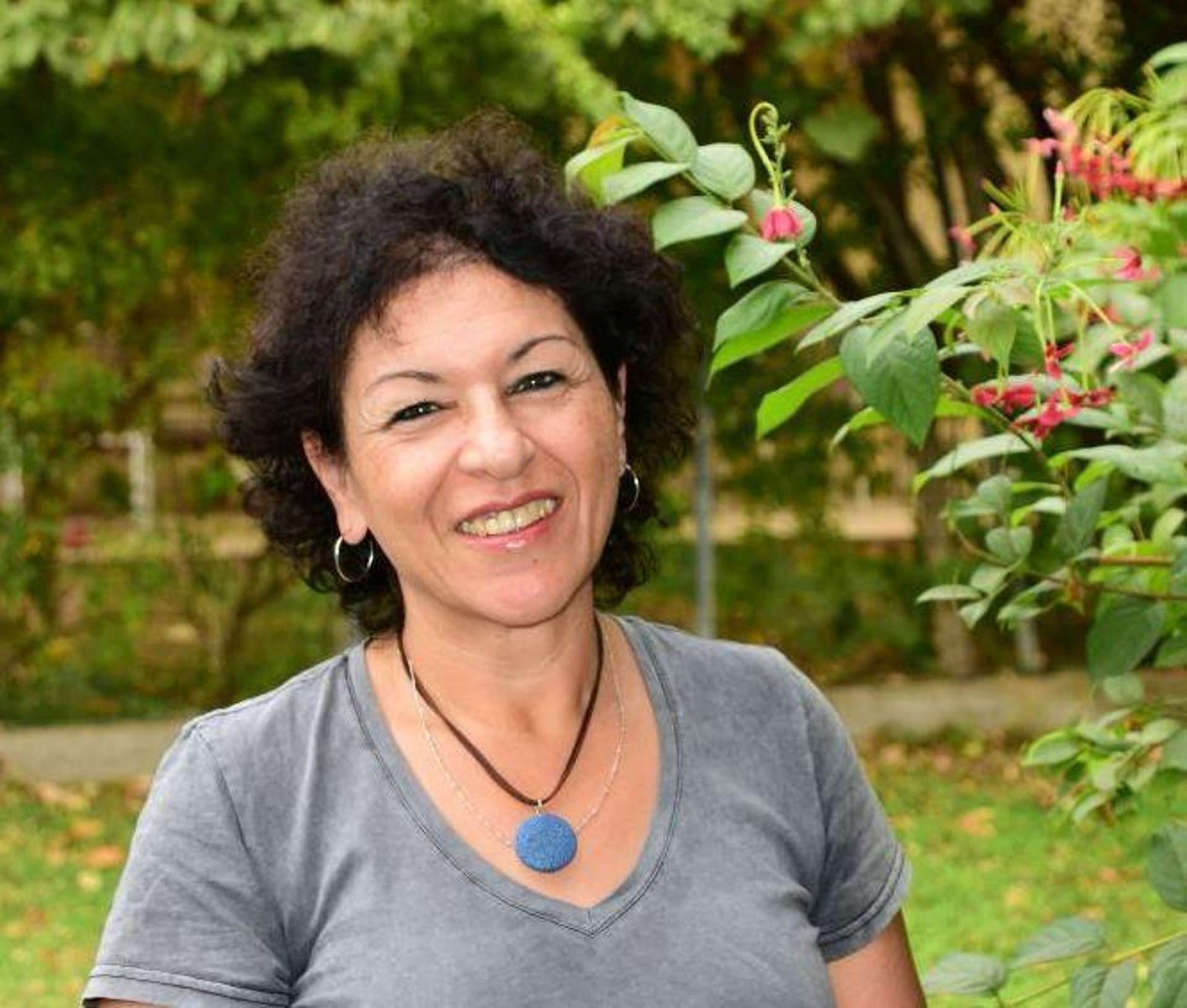 persons hand on white textile