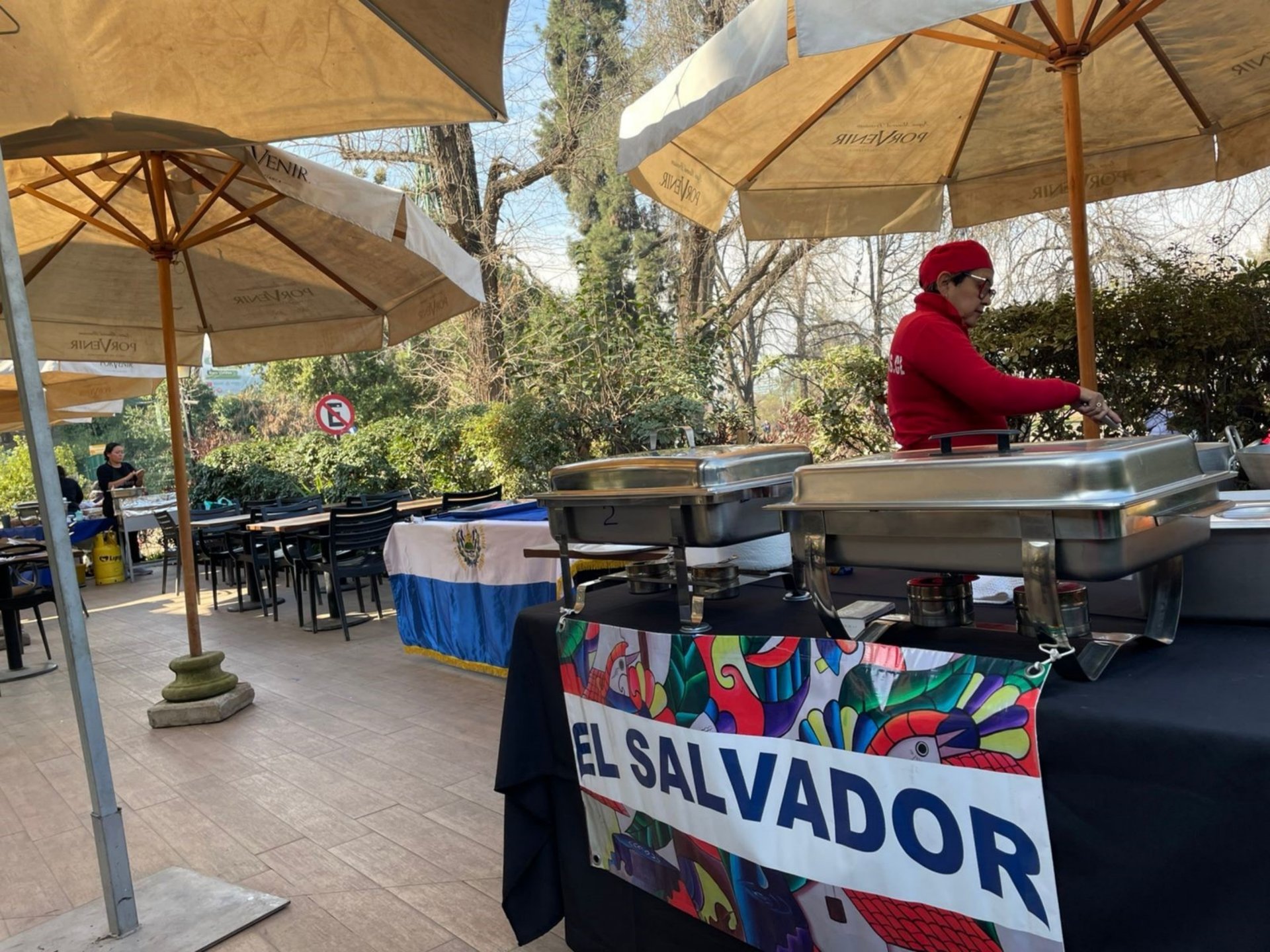 an abstract photo of a curved building with a blue sky in the background