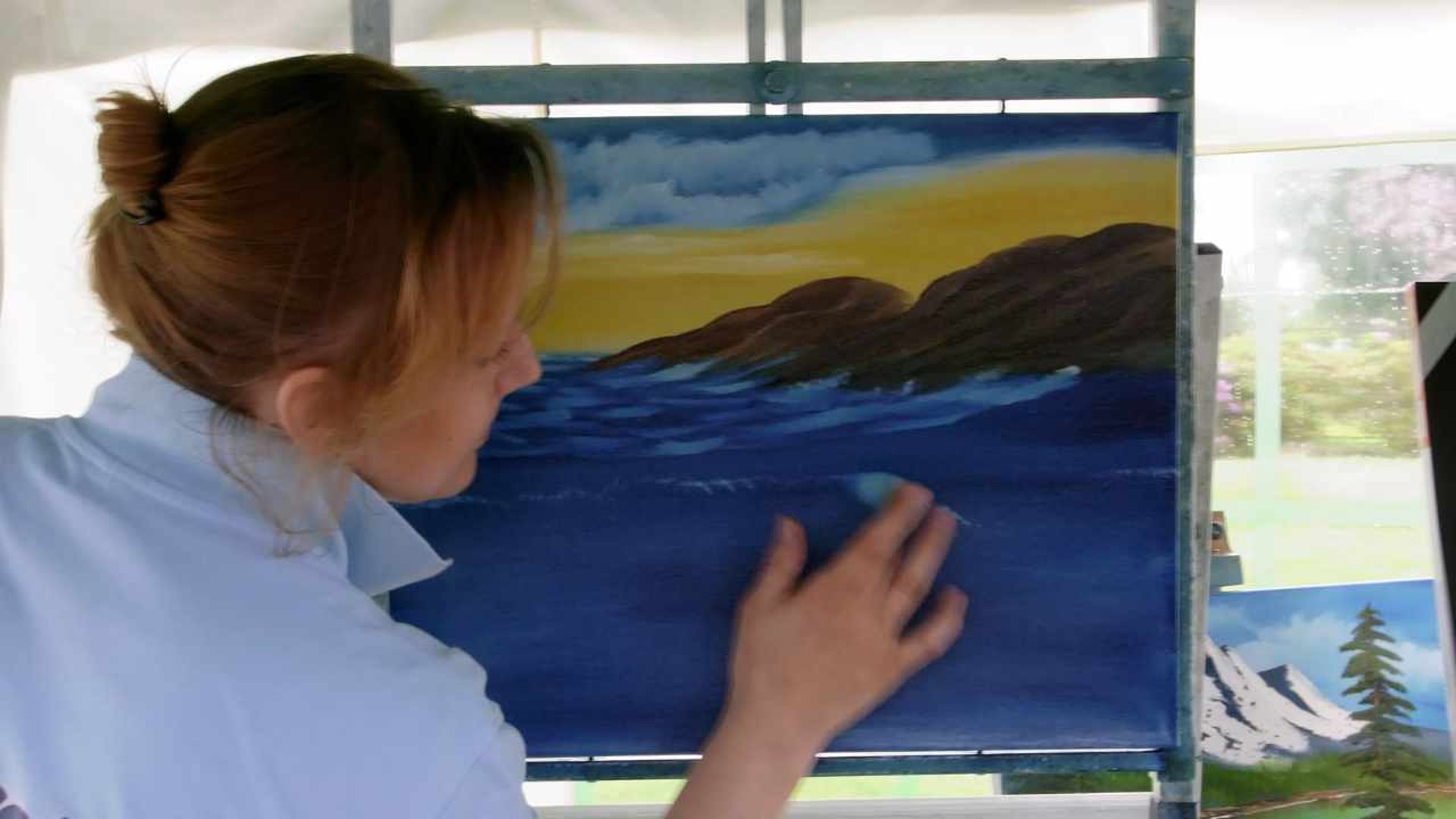 woman wearing yellow long-sleeved dress under white clouds and blue sky during daytime