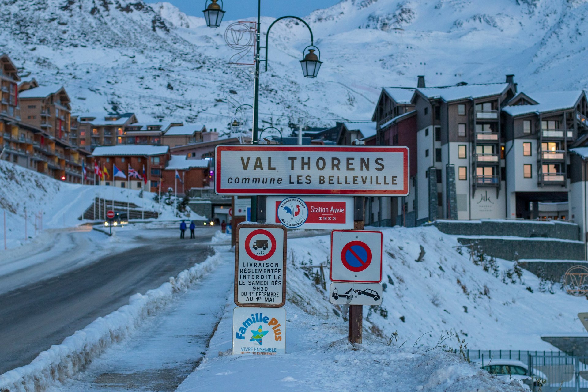 Val Thorens entrance sign surrounded by snowy mountain scenery and alpine buildings in the French Alps