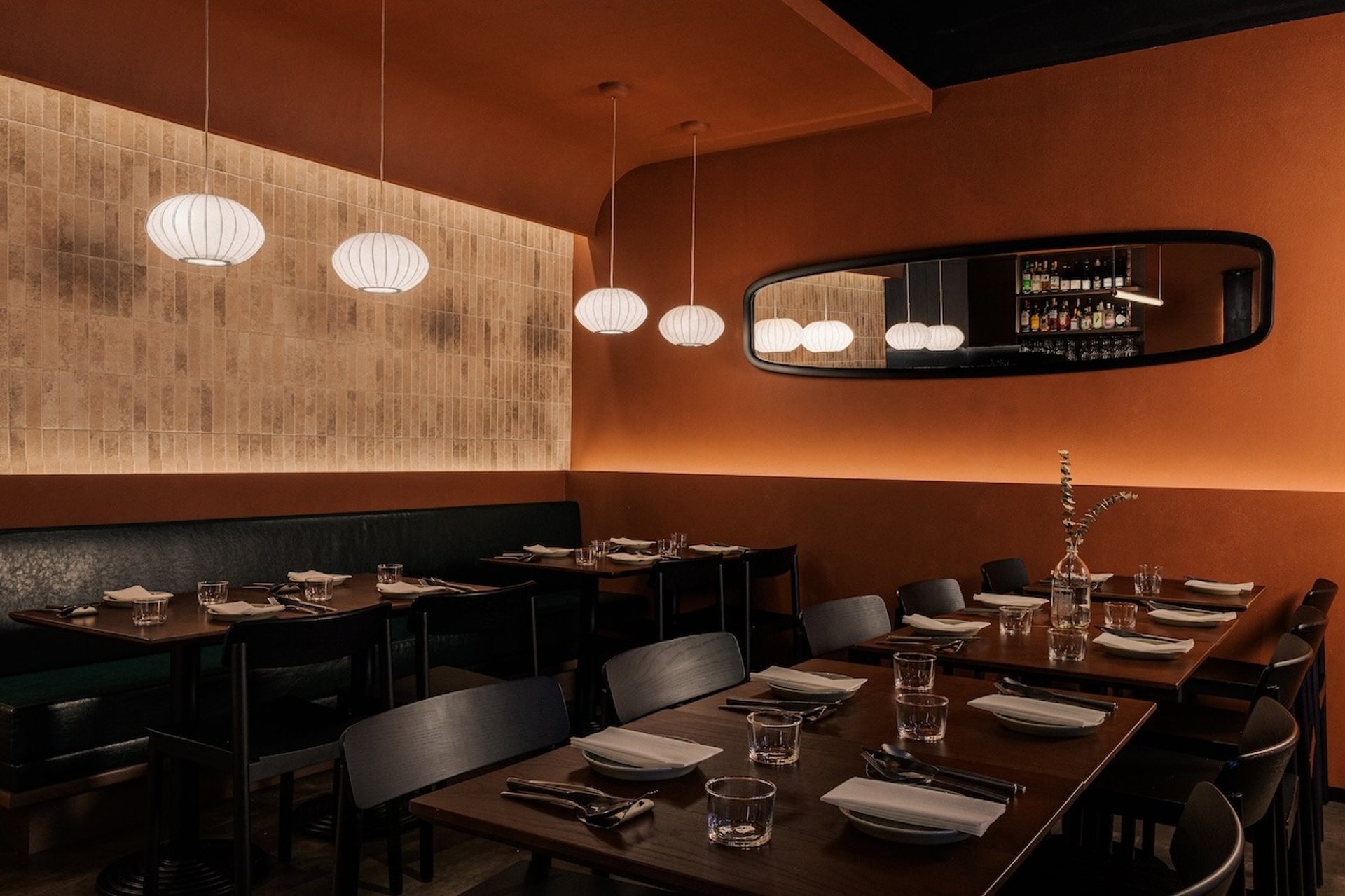 person holding white plate with food