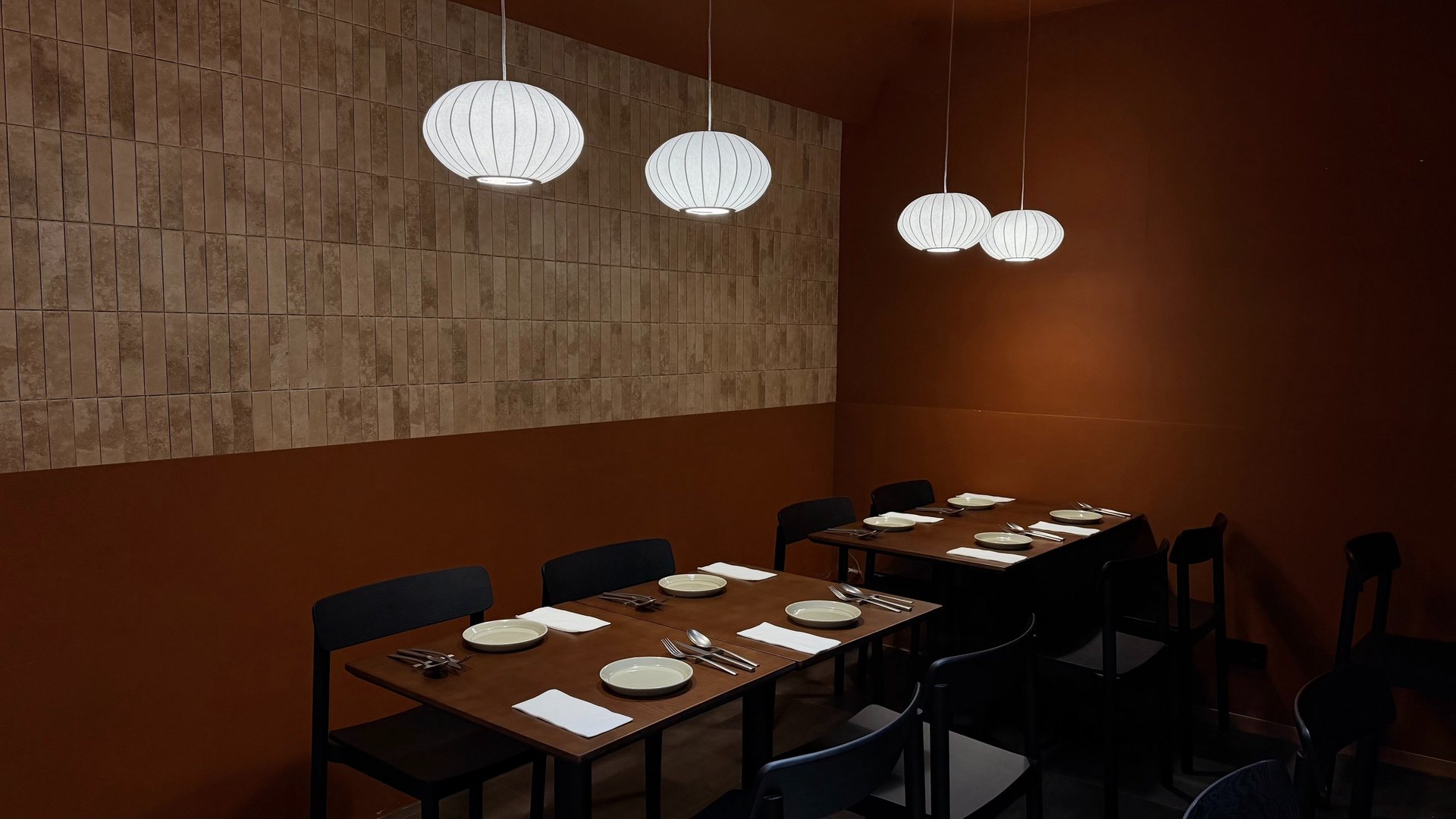 person holding white plate with food